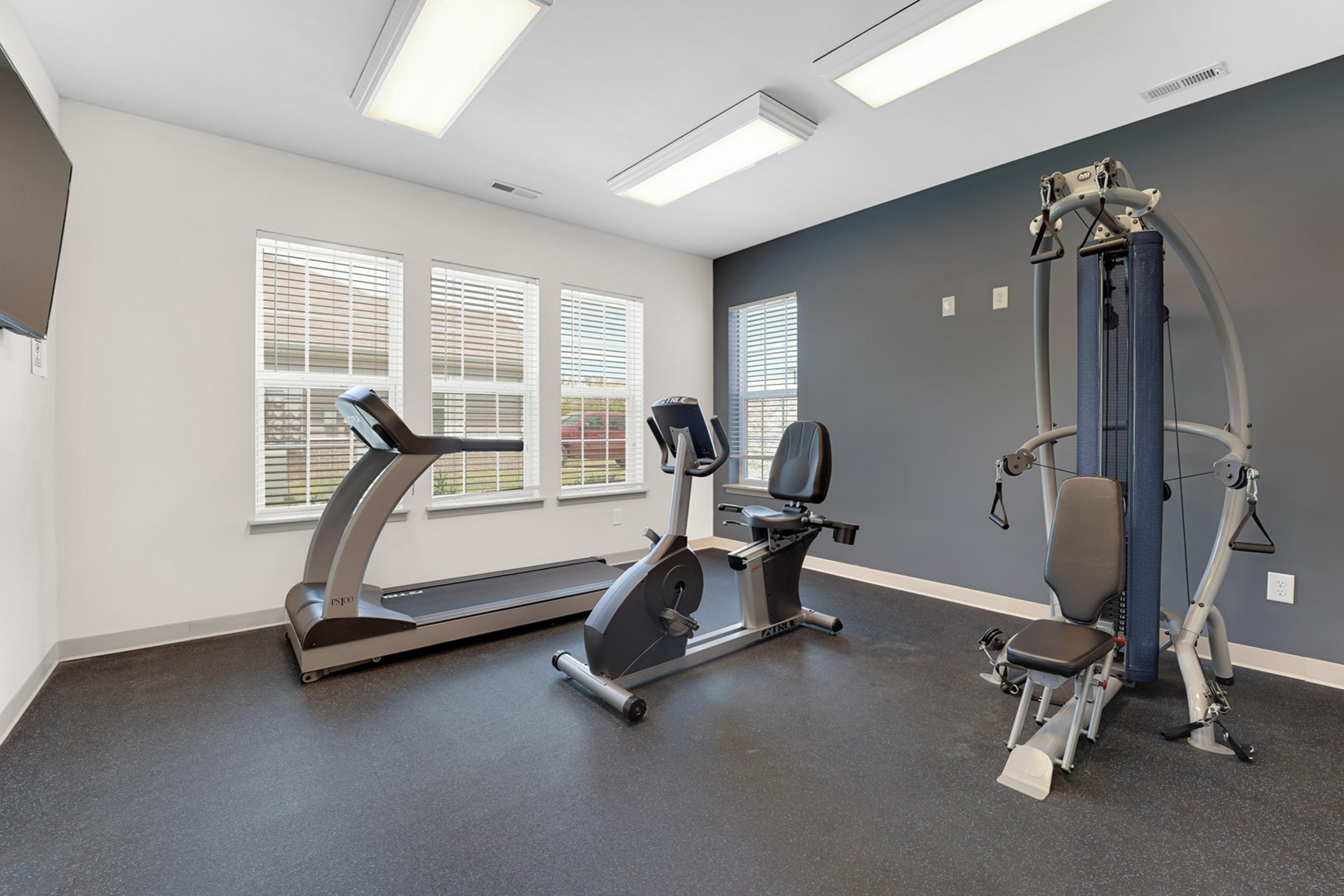 a room filled with furniture and a large window