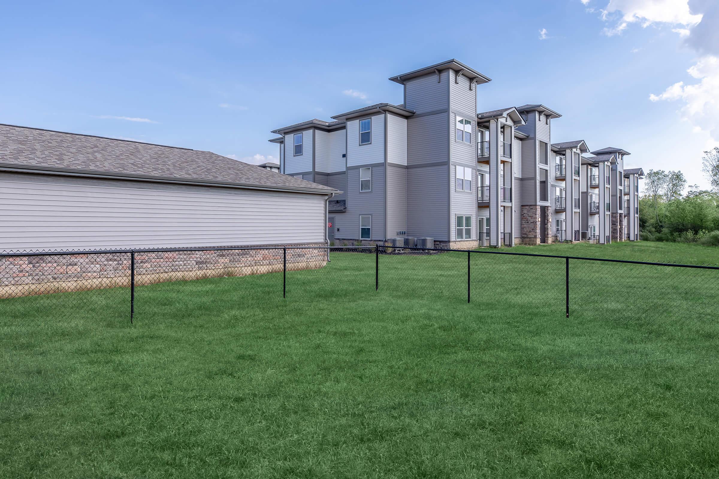 a building with a grassy field