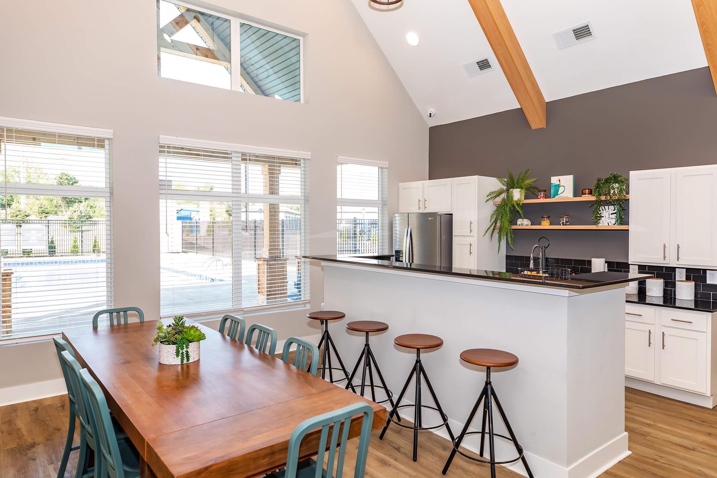 a kitchen with a dining room table