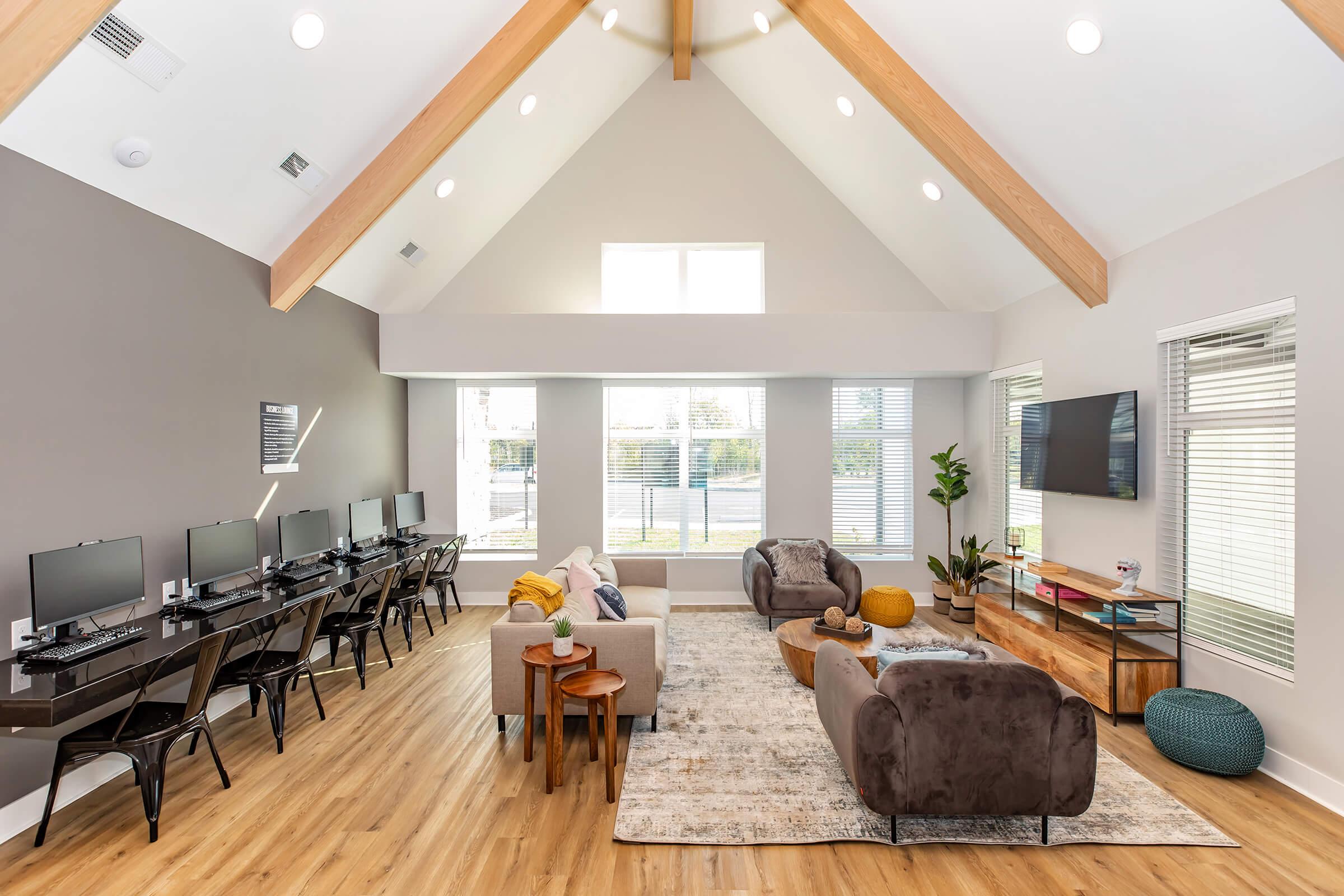 a living room filled with furniture and a large window