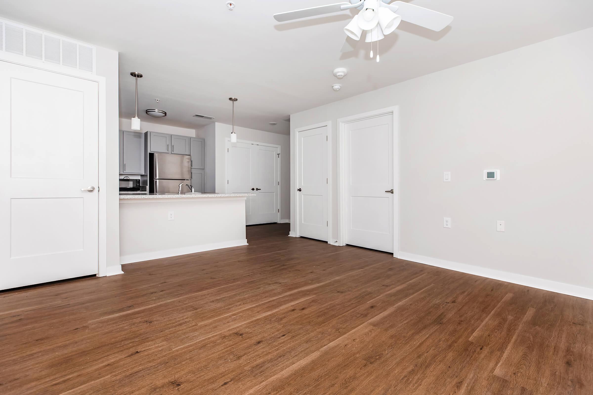 a kitchen with a wooden floor