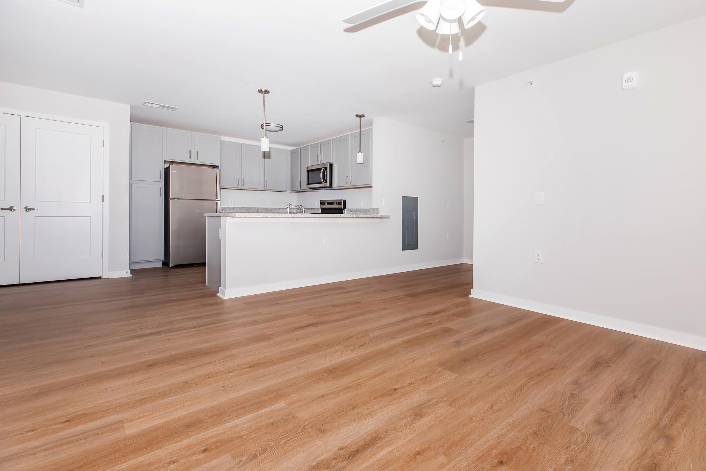 a kitchen with a wood floor