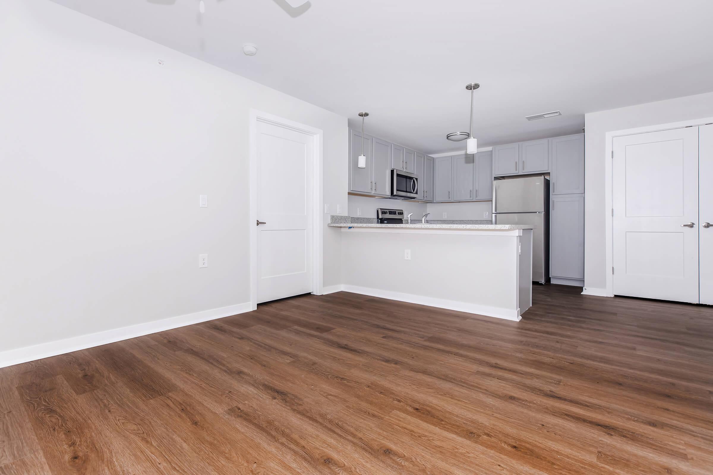 a kitchen with a wood floor