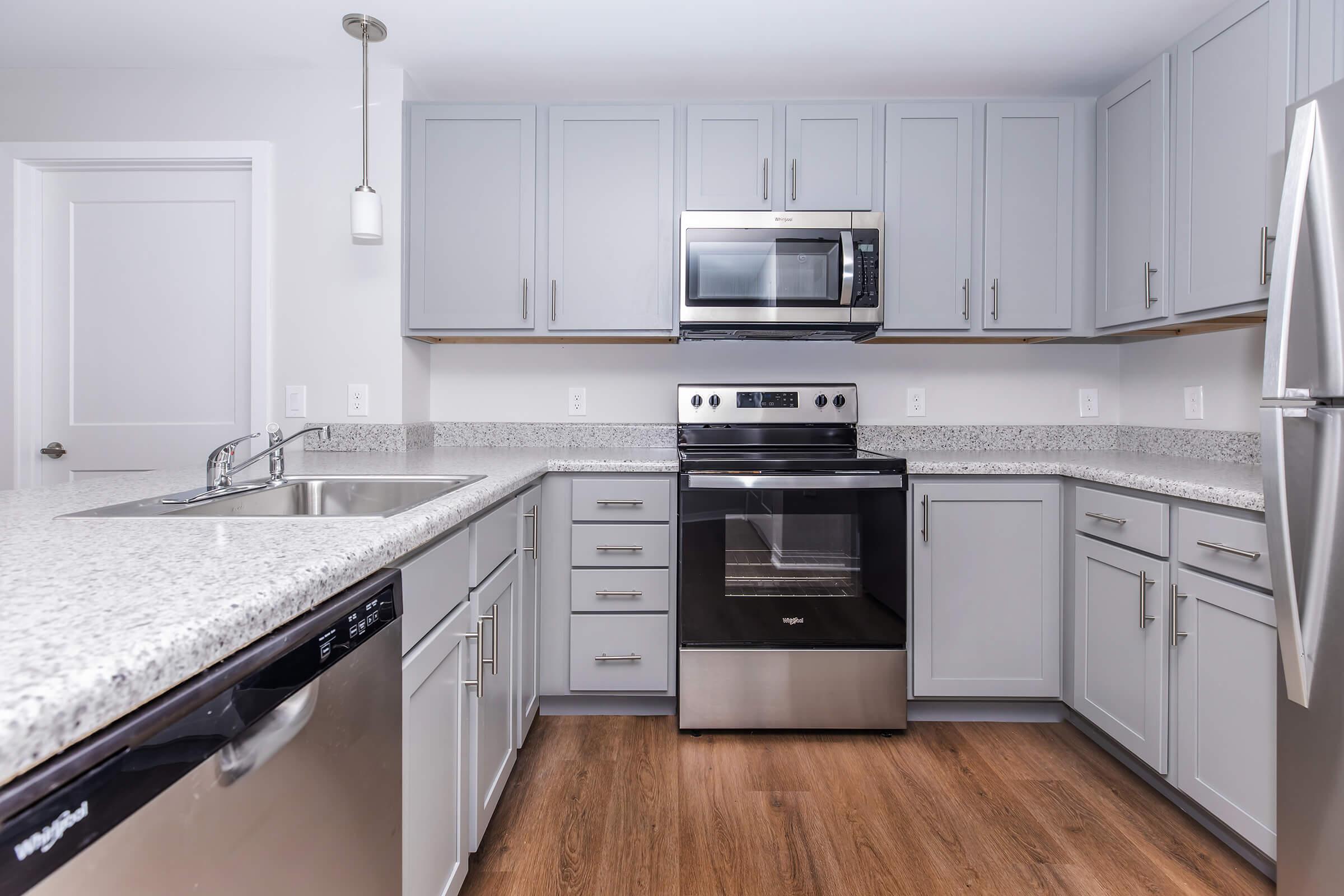 a kitchen with a stove top oven