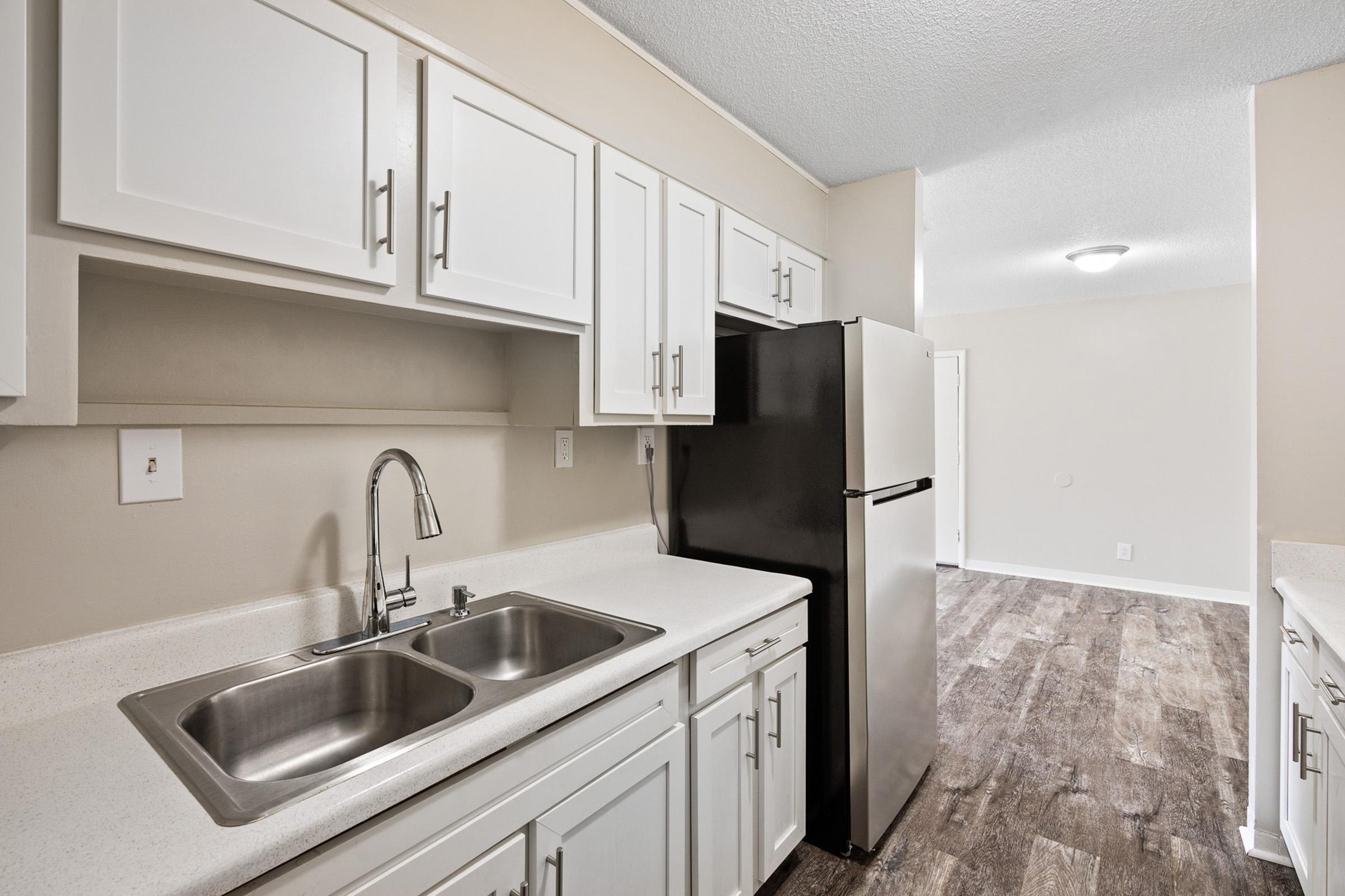 a kitchen with a sink and a microwave