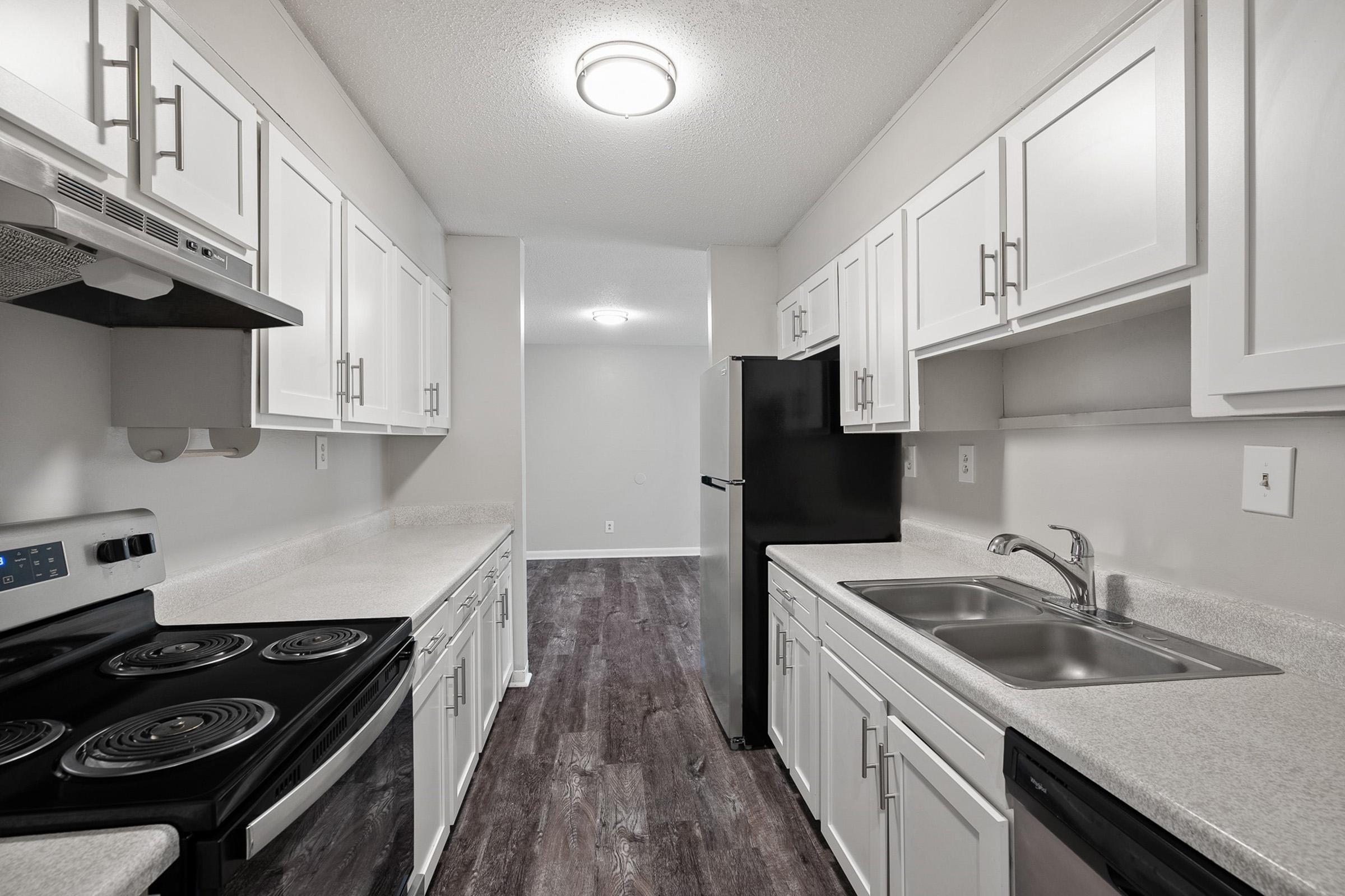 a kitchen with a stove and a sink