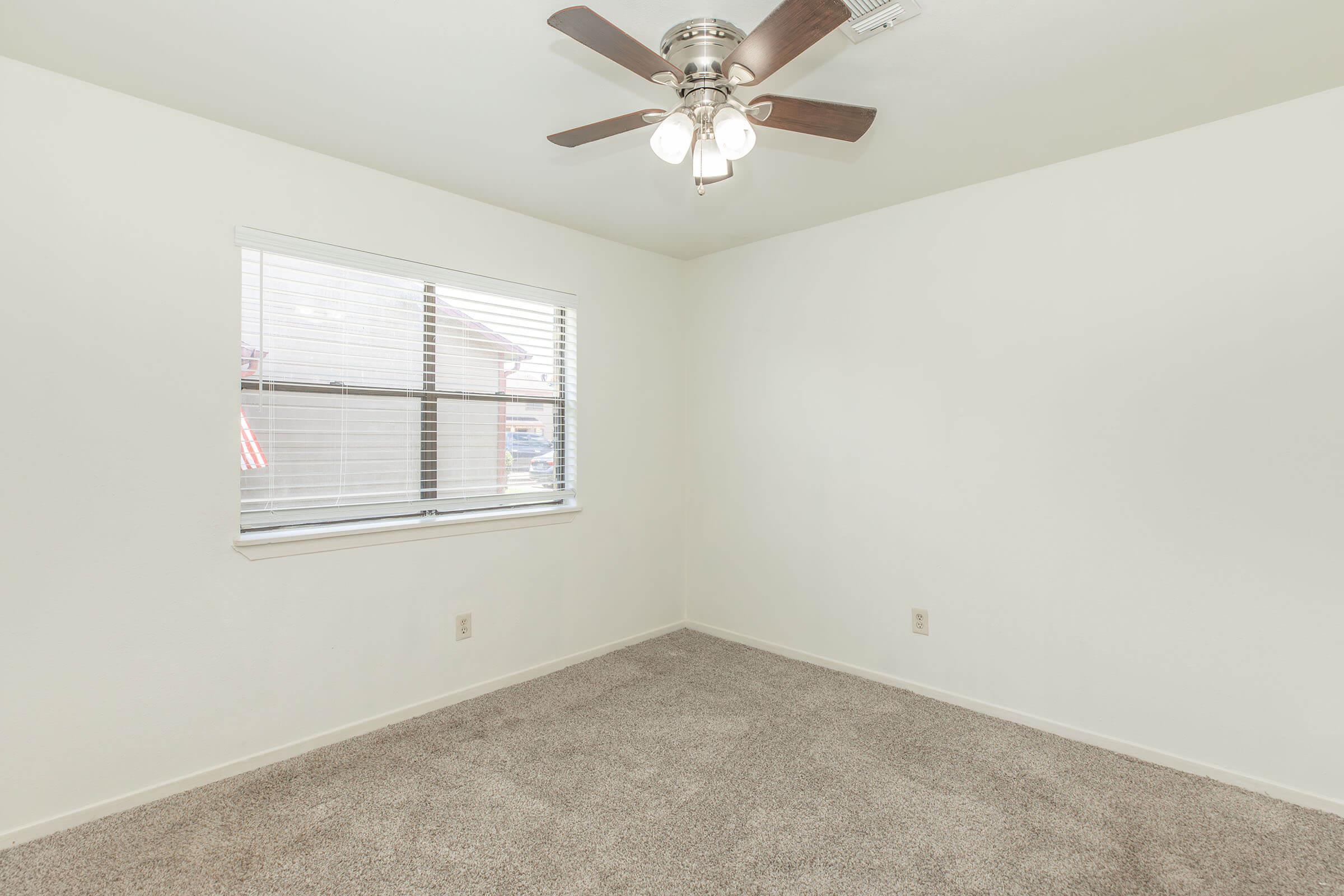 a bedroom with a large mirror