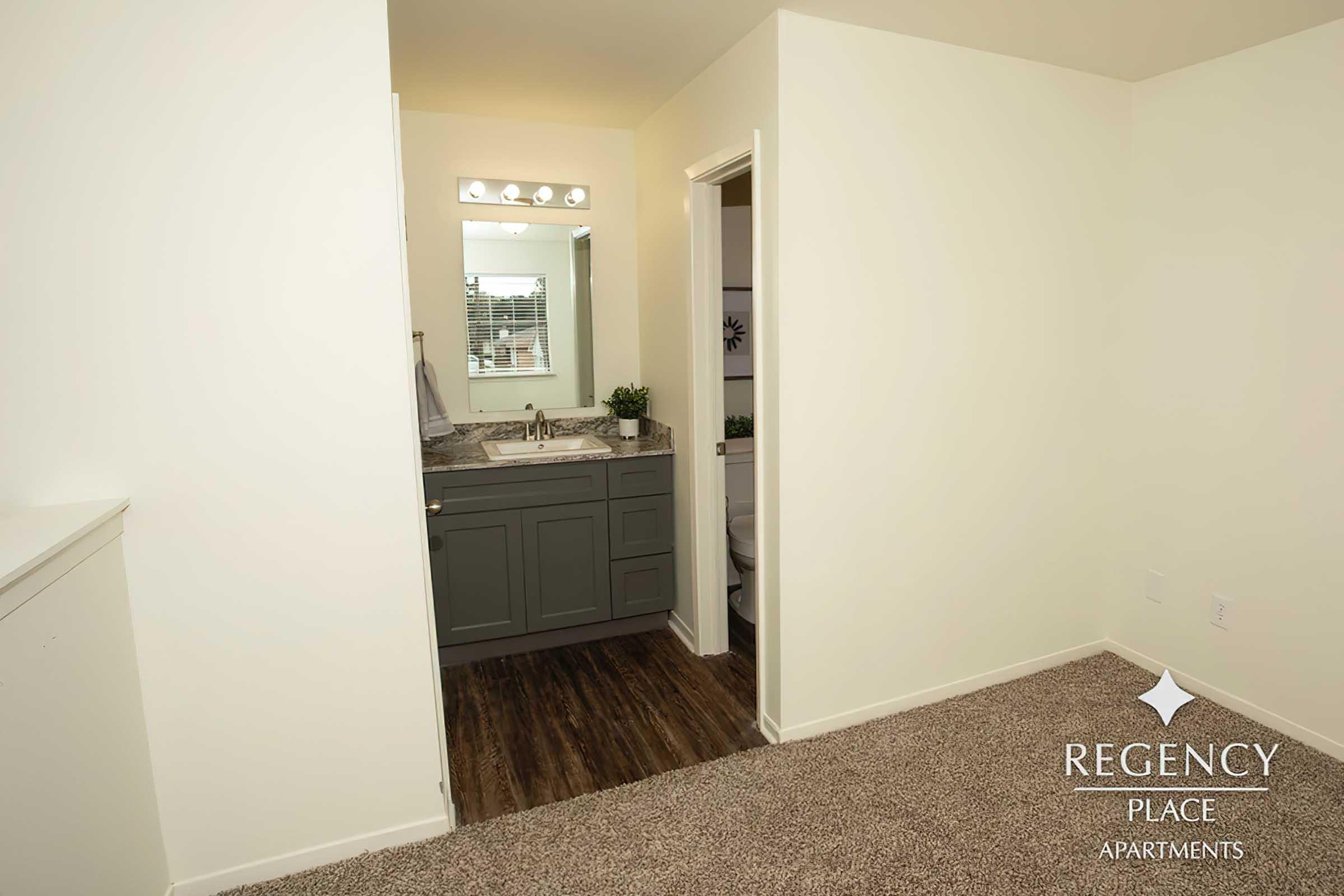 a bedroom with a large mirror