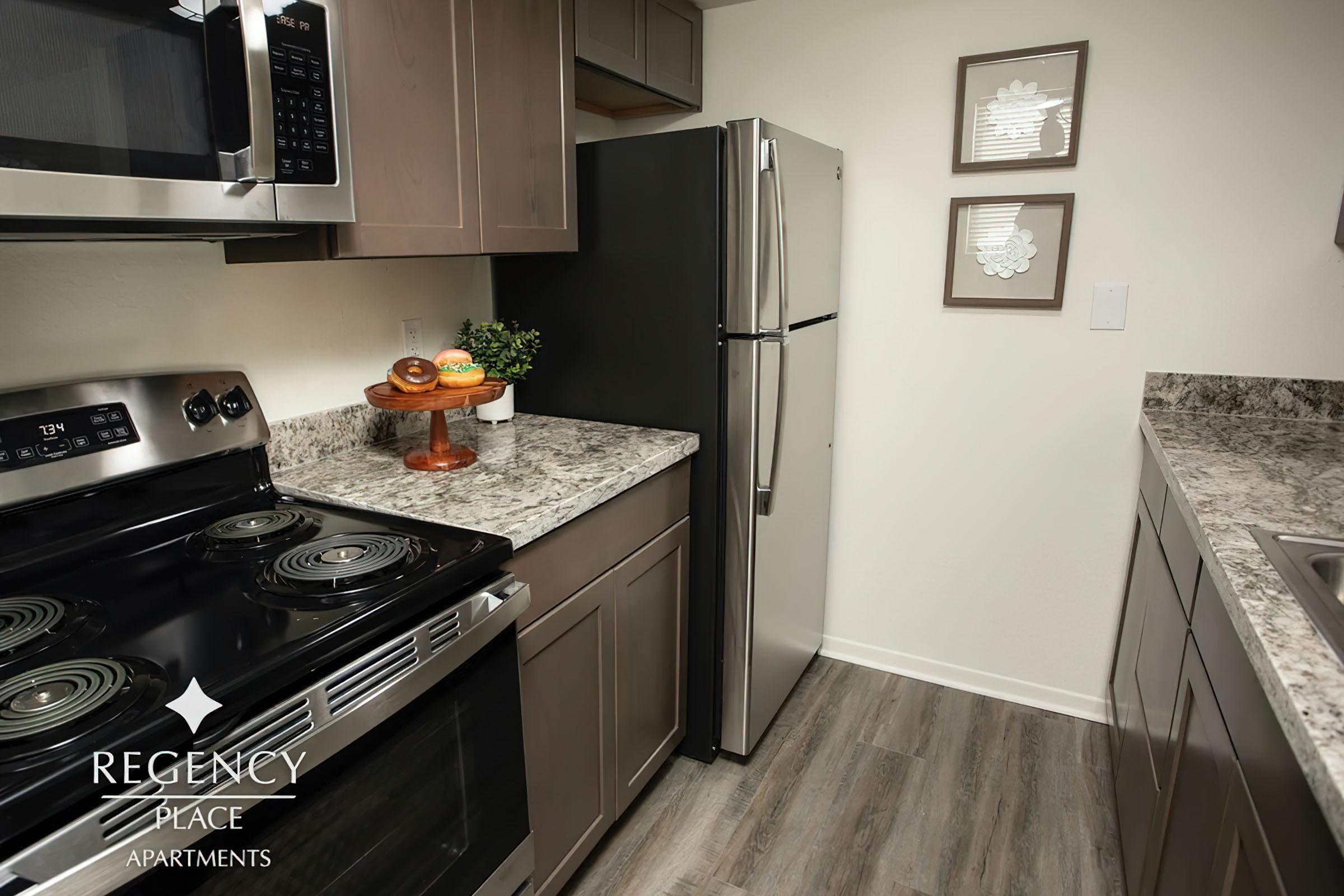 a kitchen with a microwave oven sitting on top of a stove