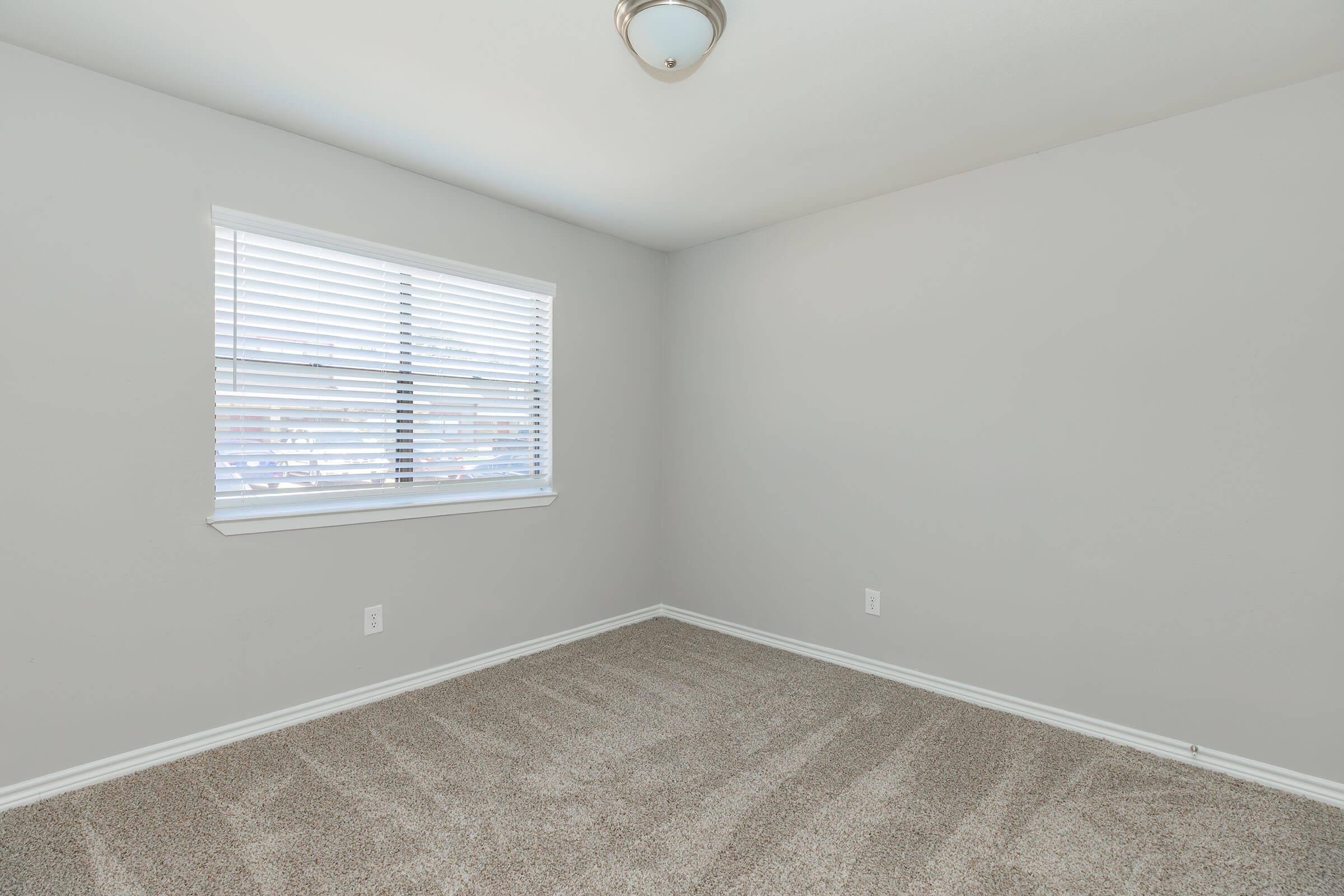 a bedroom with a large mirror