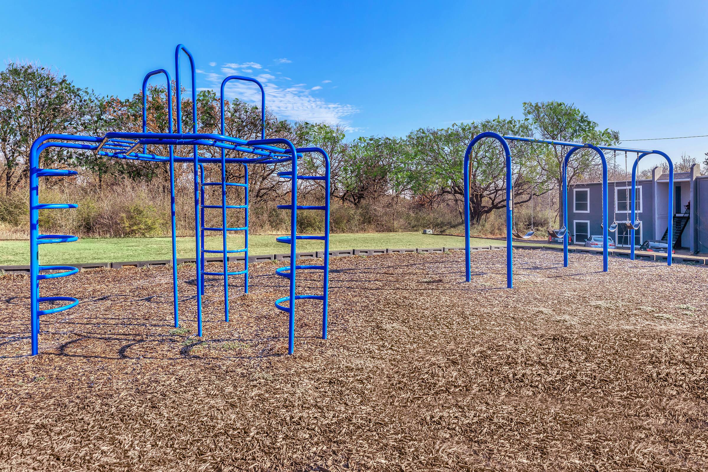 a playground inside a fence