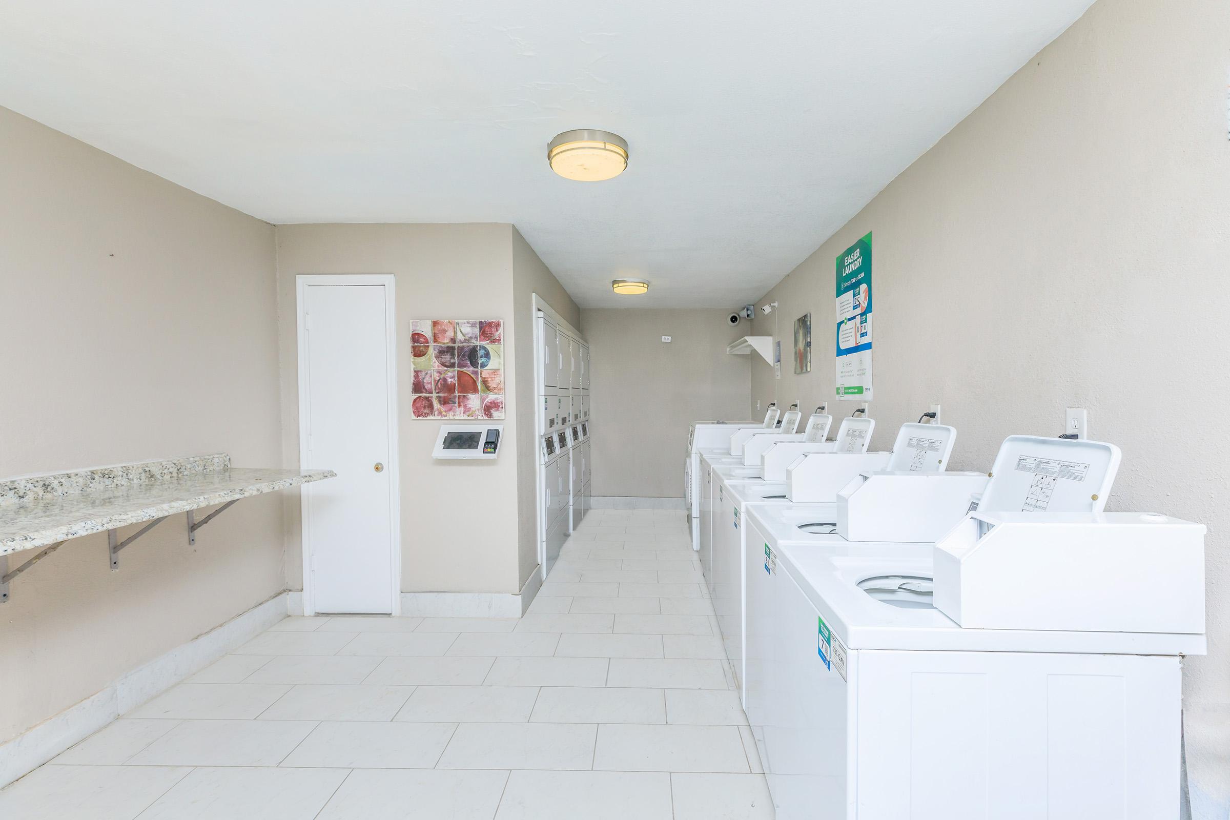 a kitchen with a sink and a refrigerator