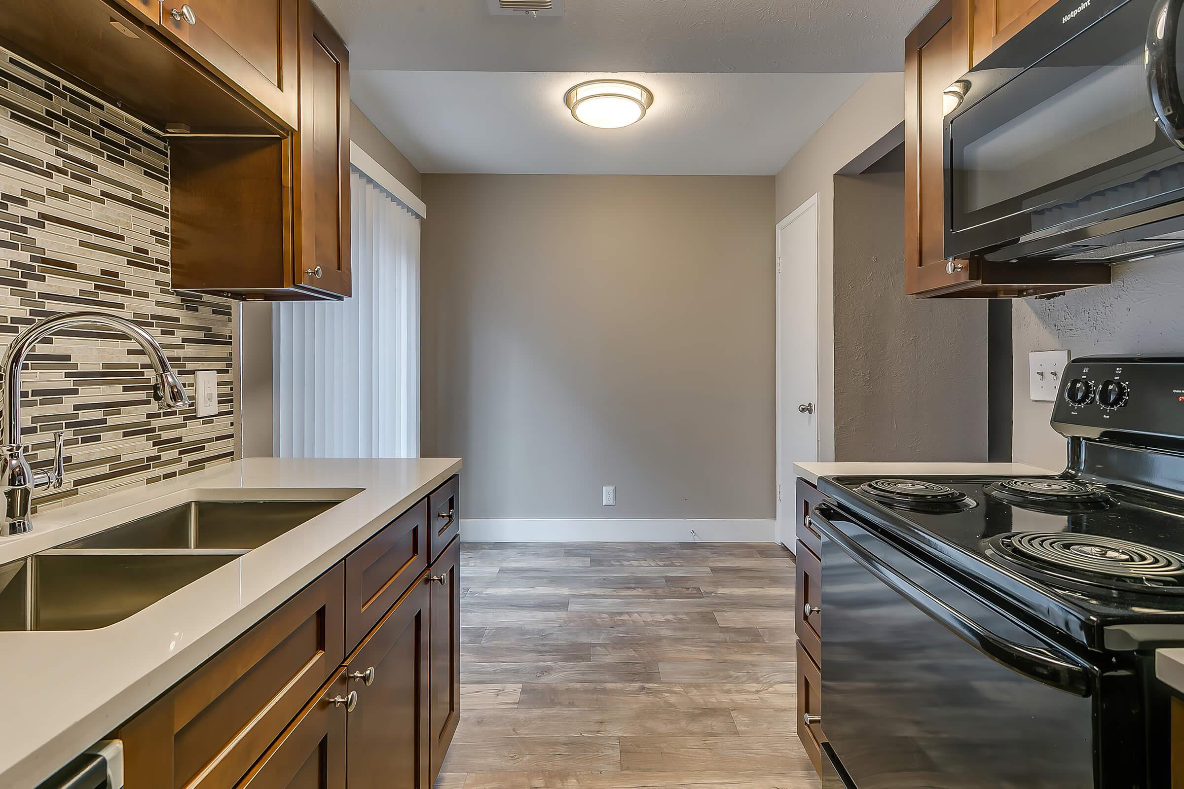 a kitchen with a large mirror