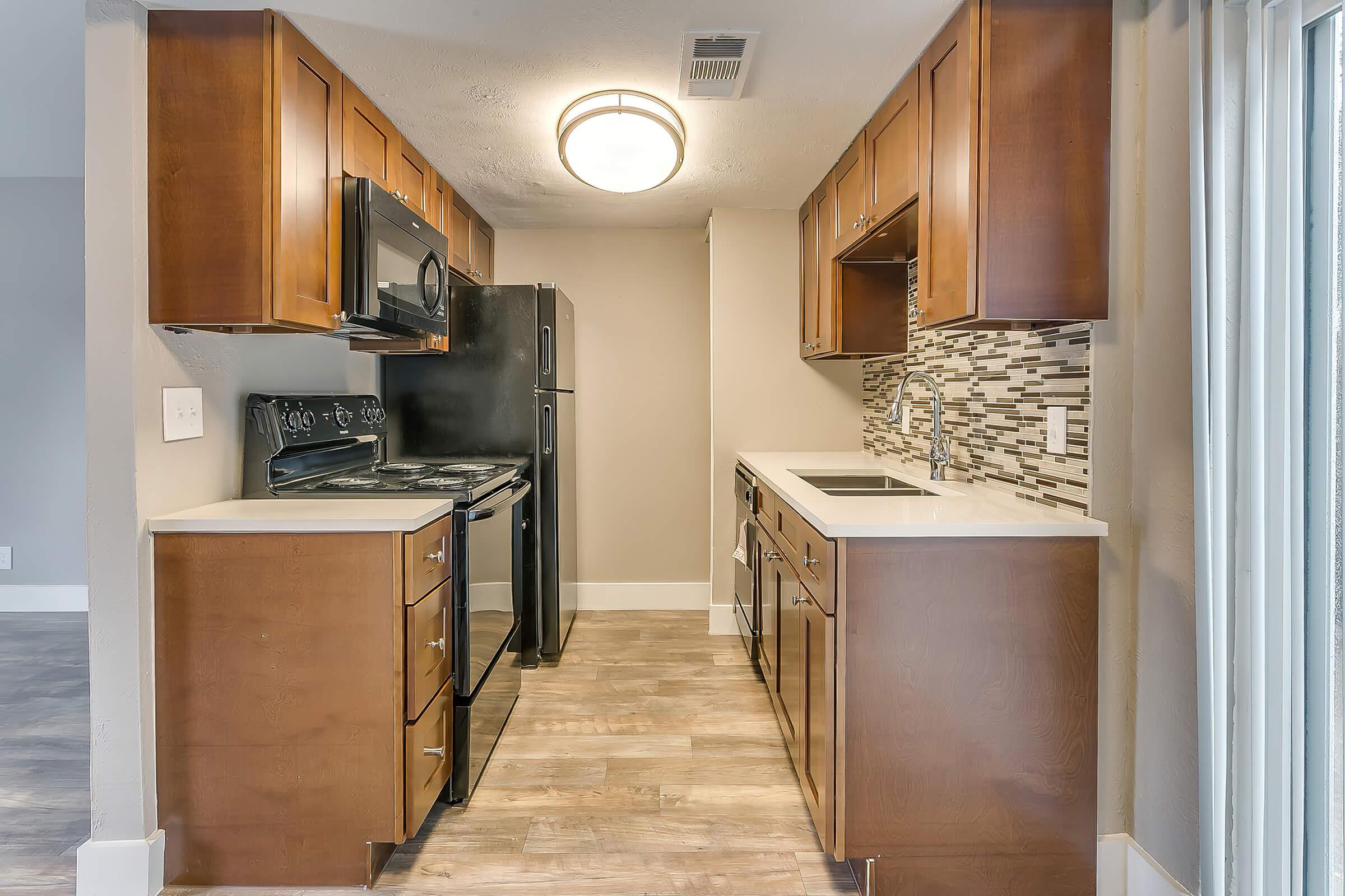 a kitchen with an open door