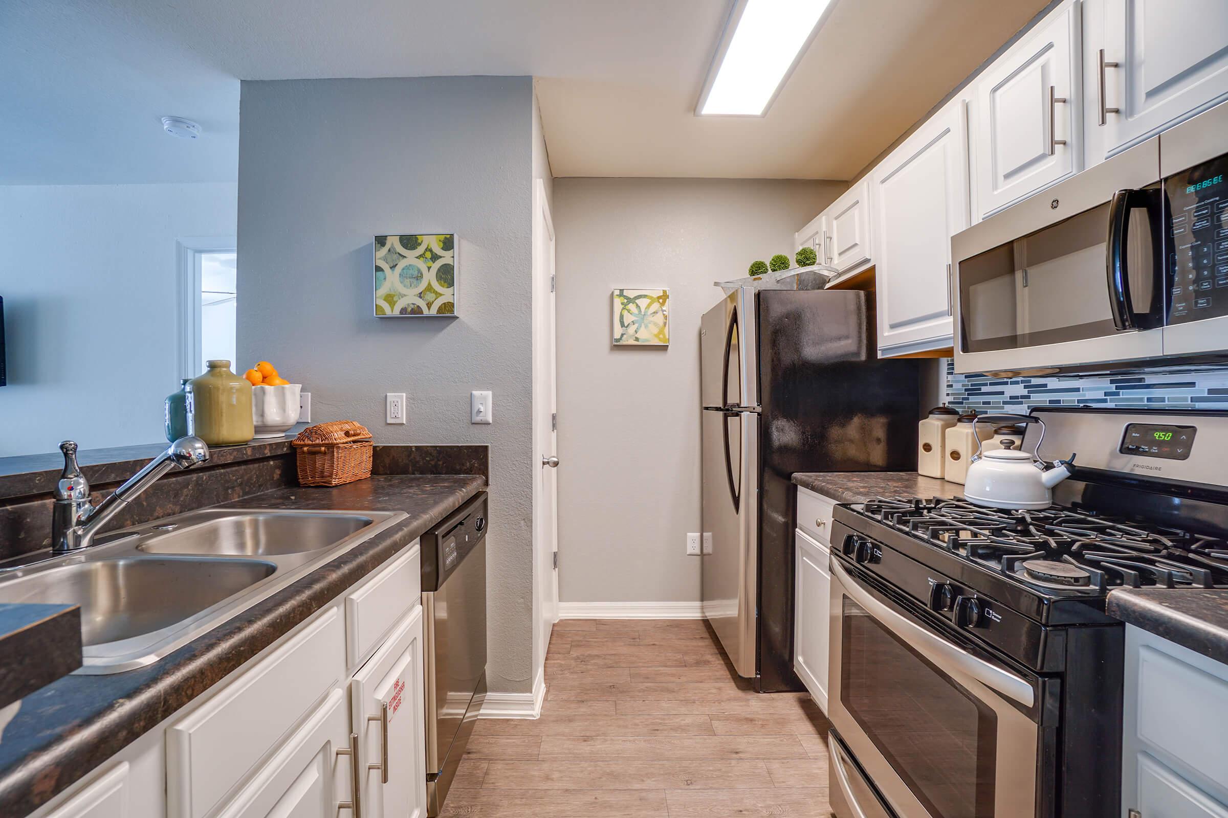 a modern kitchen with stainless steel appliances