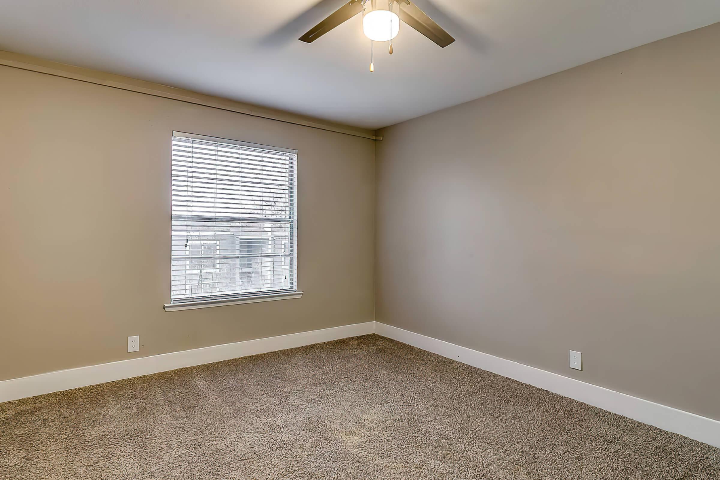 a bedroom with a large window