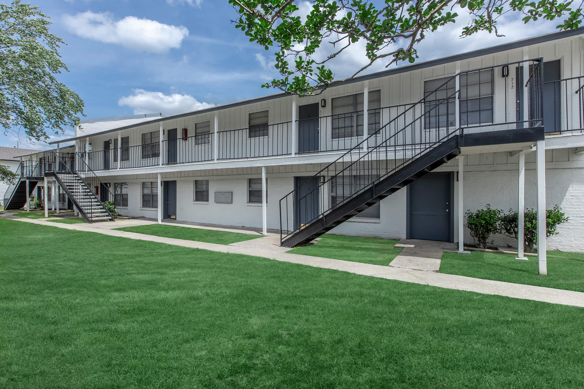 a large lawn in front of a house