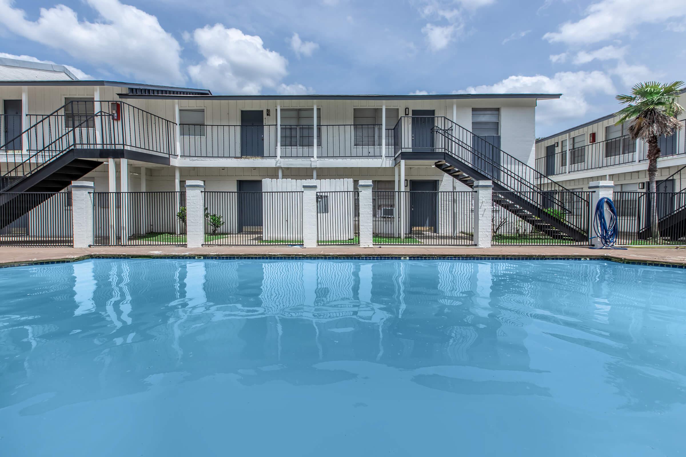 a house with a large pool of water