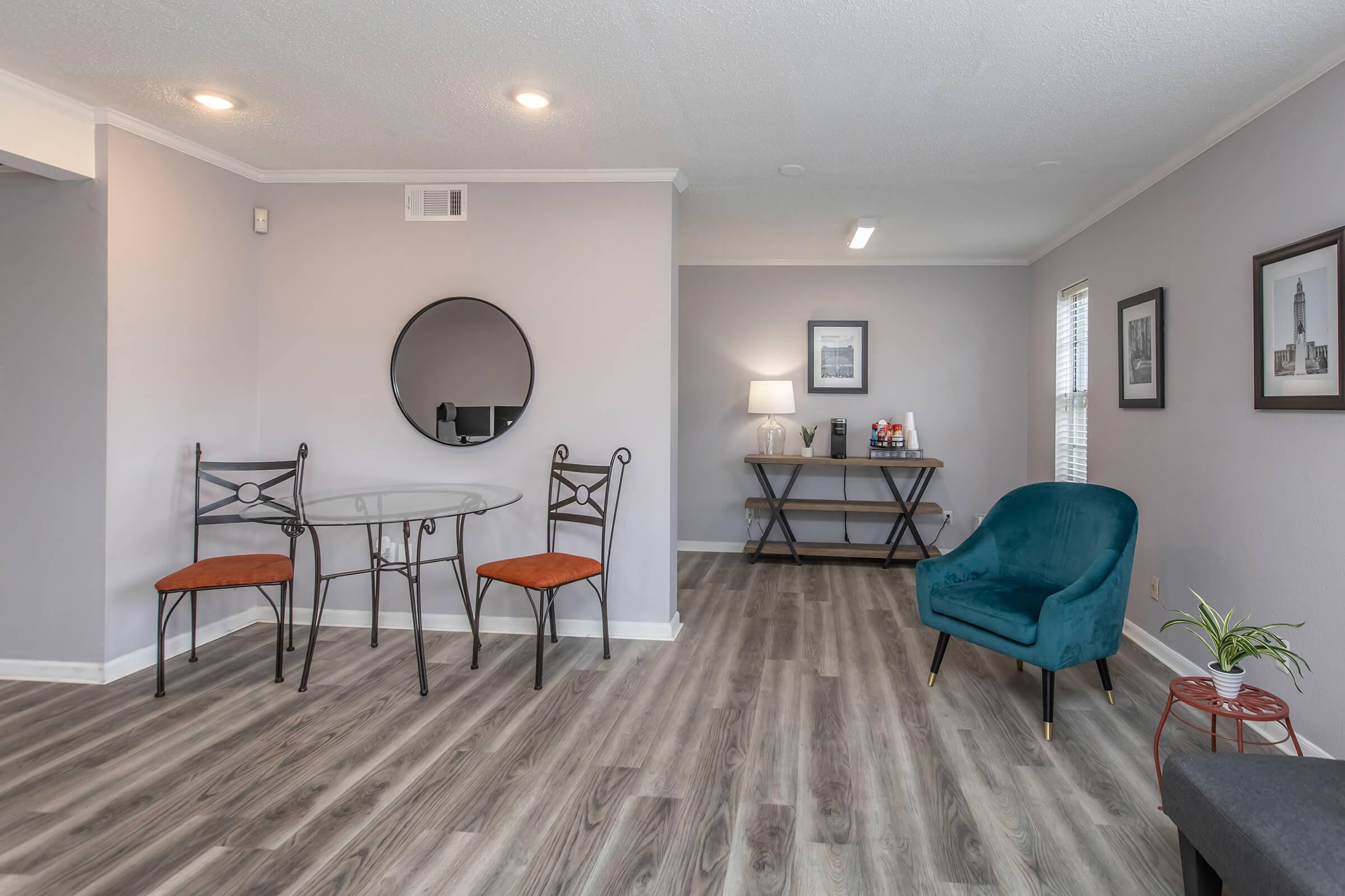 a living room filled with furniture and a flat screen tv