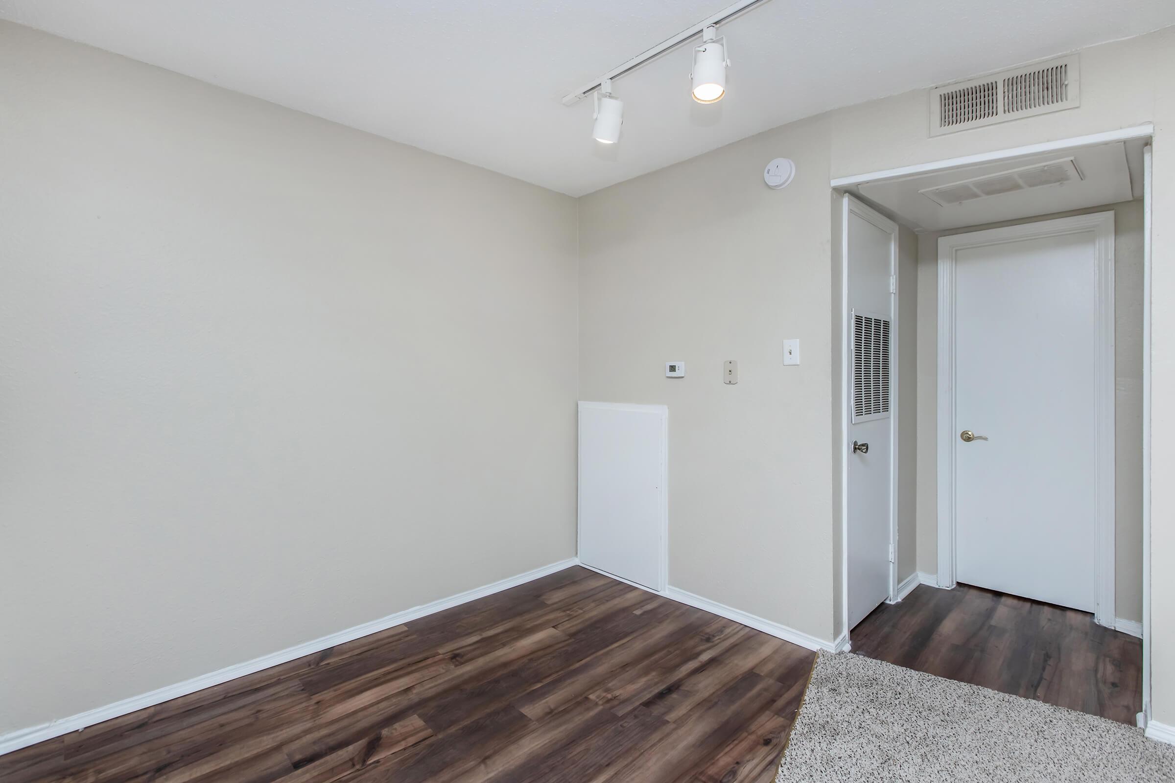 a bedroom with a large mirror