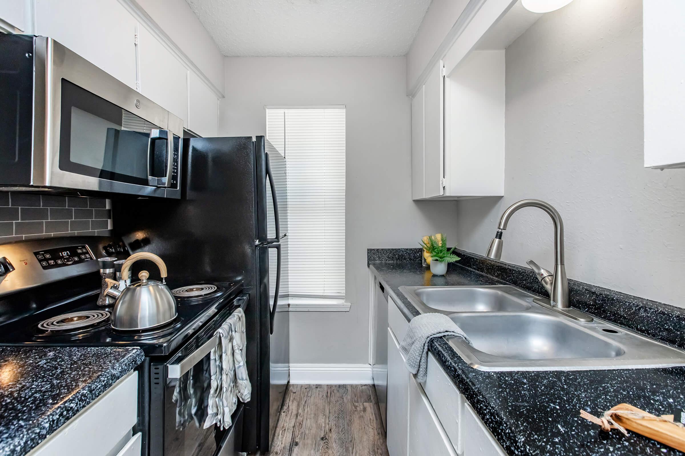 a modern kitchen with stainless steel appliances