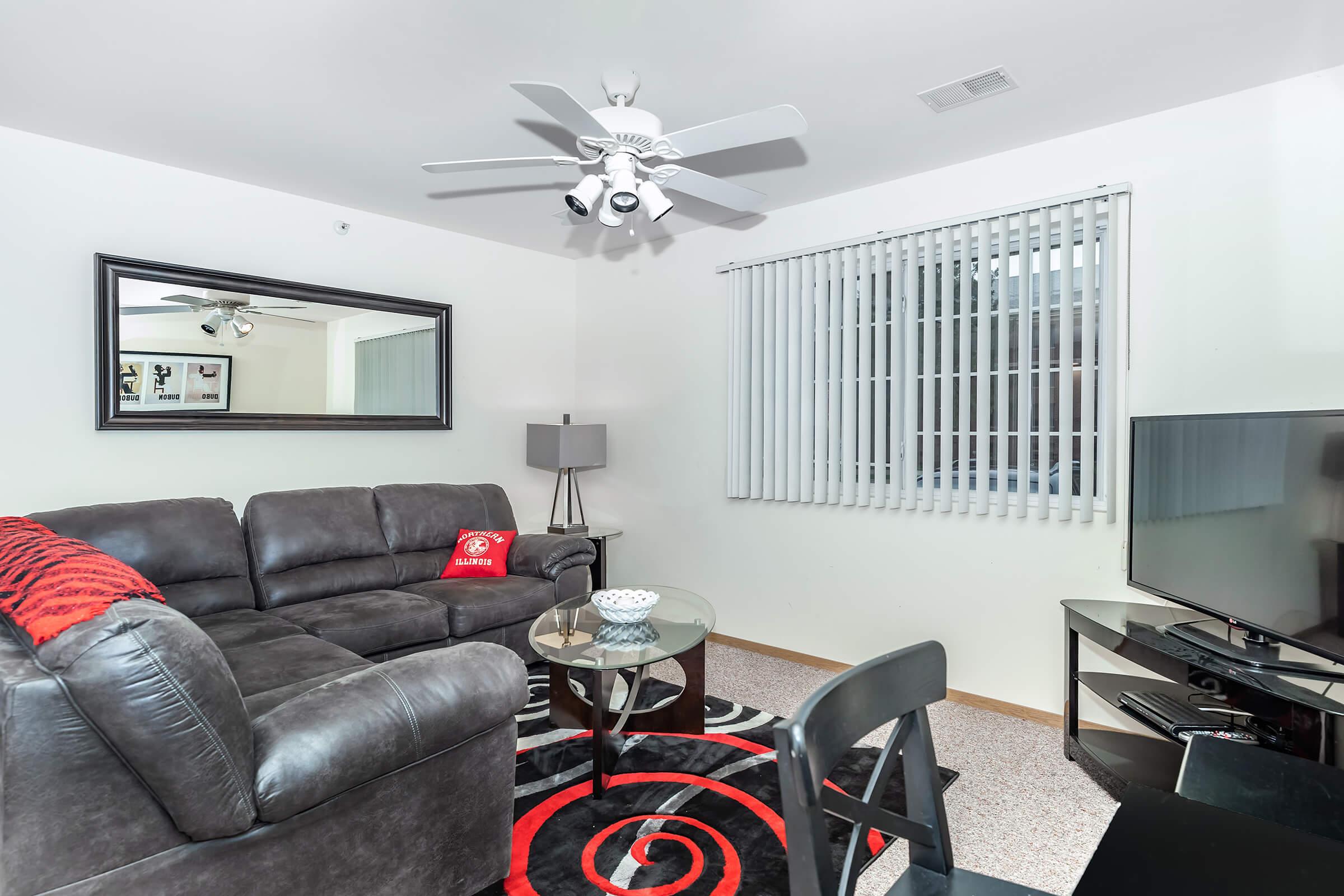 a living room with a leather chair