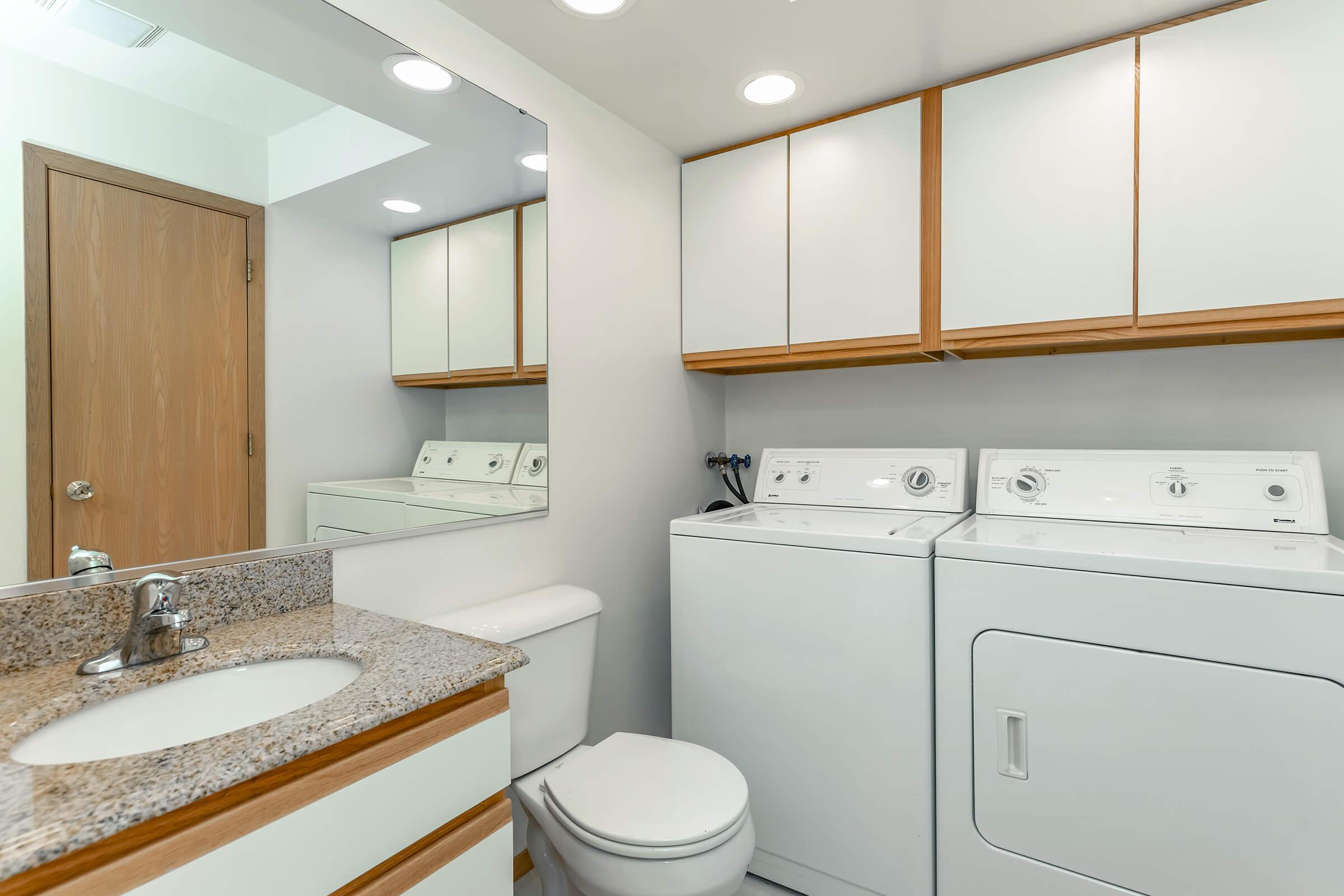 a kitchen with a sink and a mirror