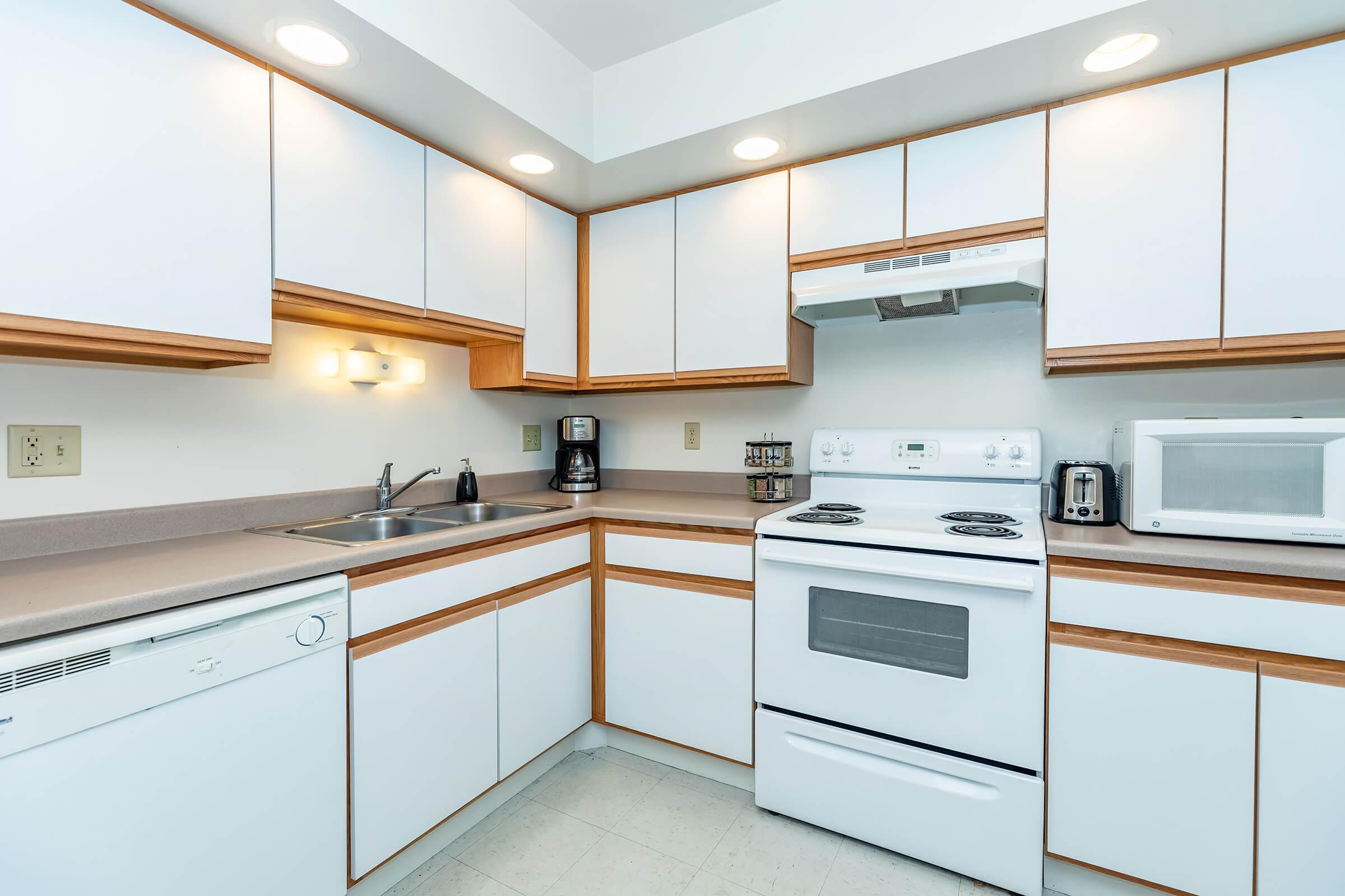 a kitchen with a stove top oven