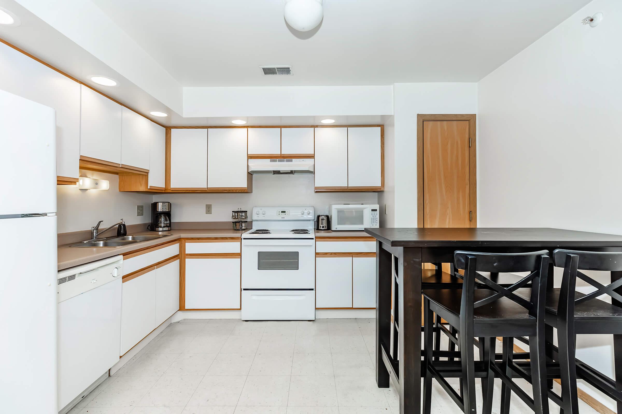 a kitchen with a dining room table