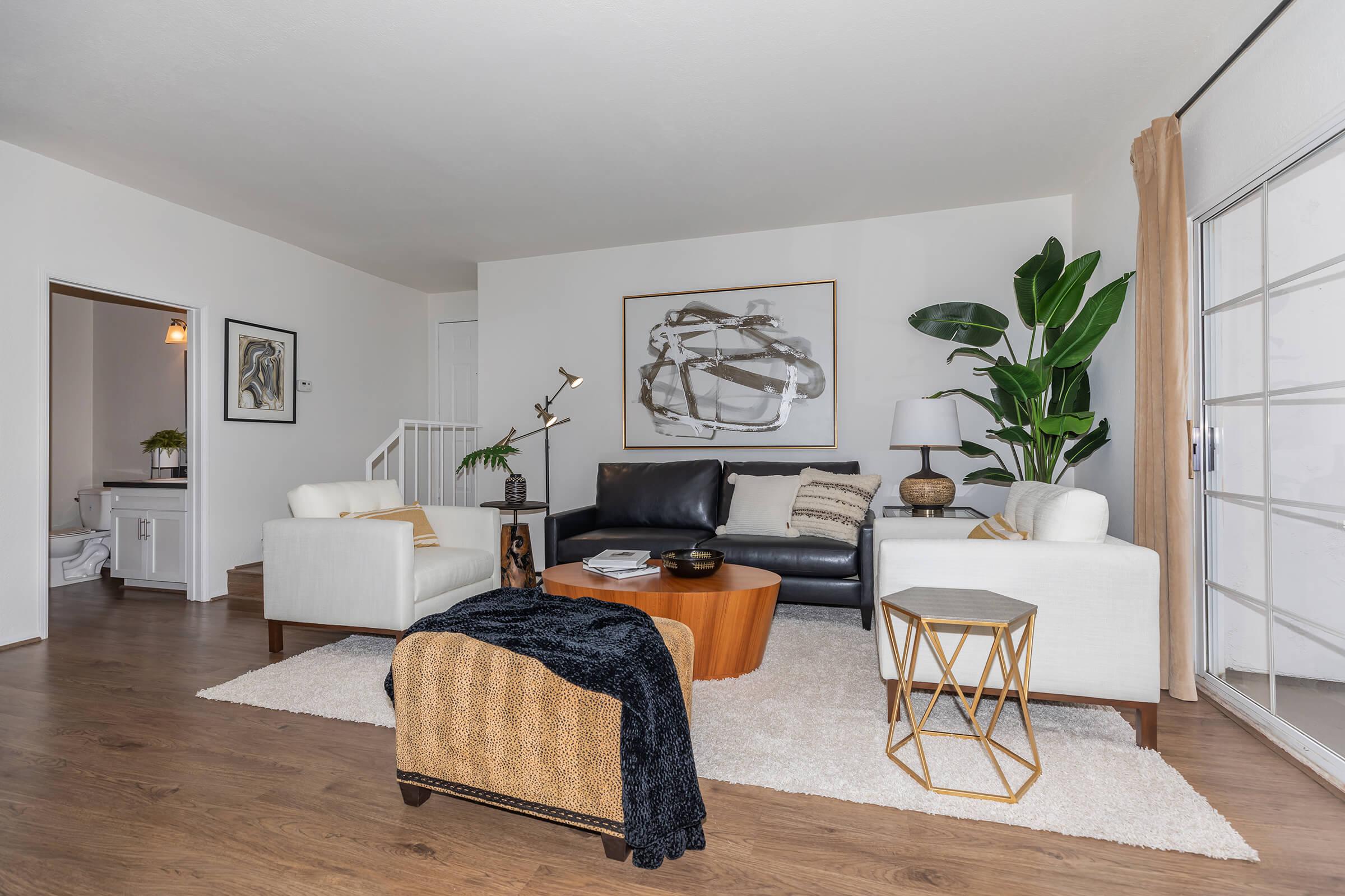 a living room with a wooden floor