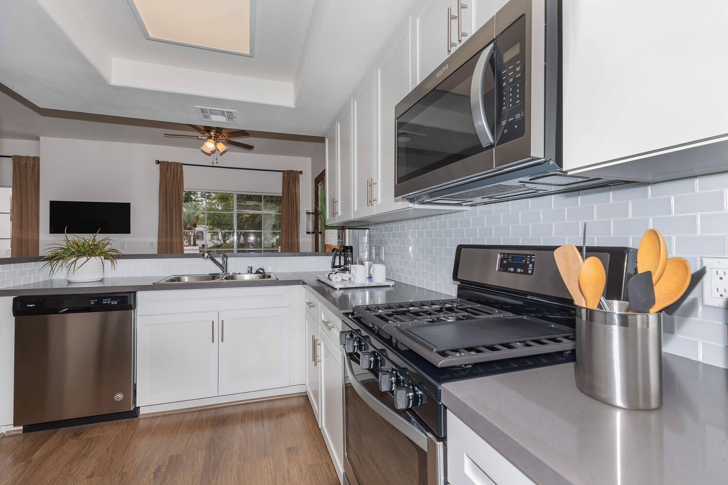a kitchen with a stove and a sink