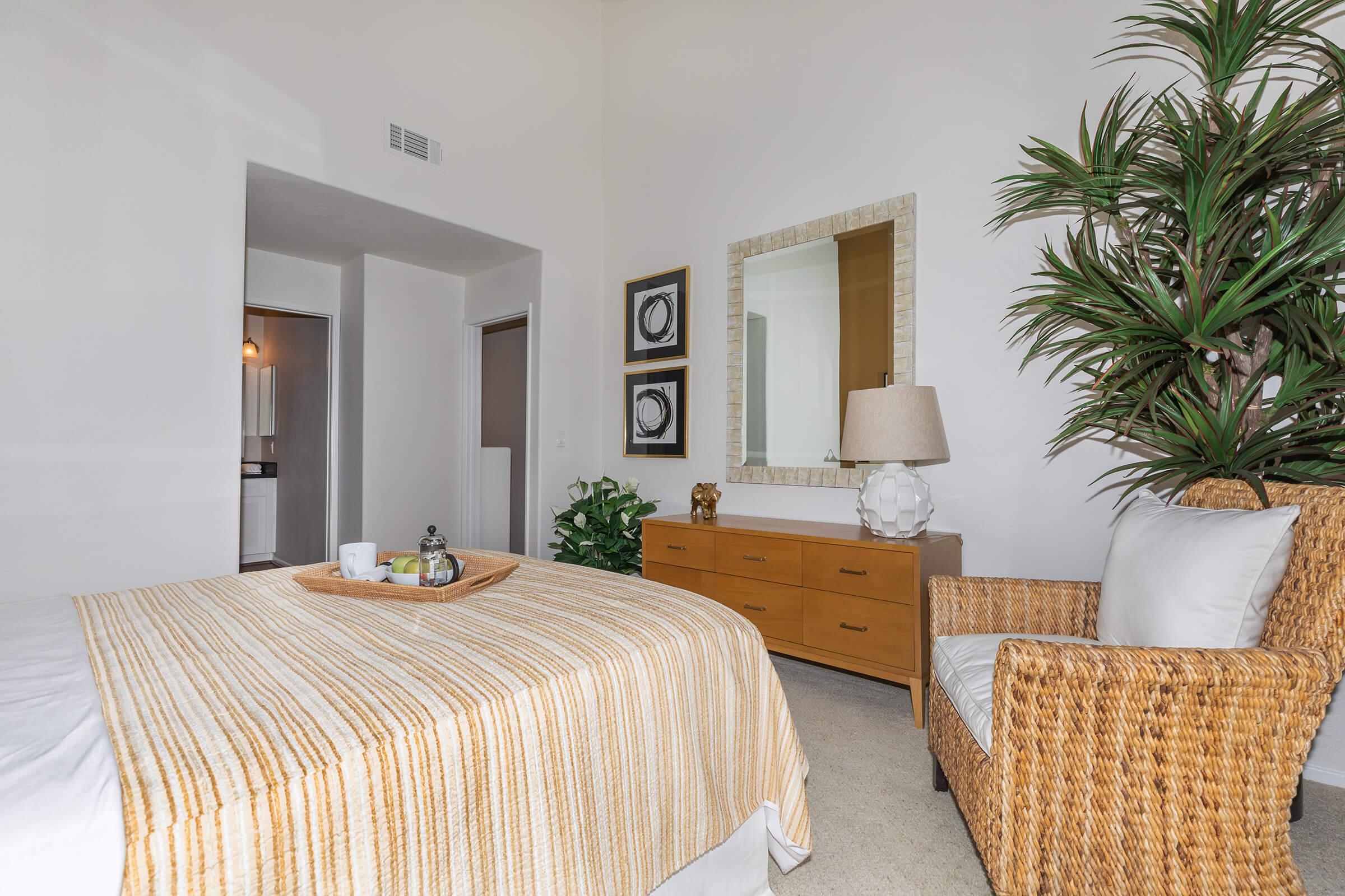 a bedroom with a large bed in a room