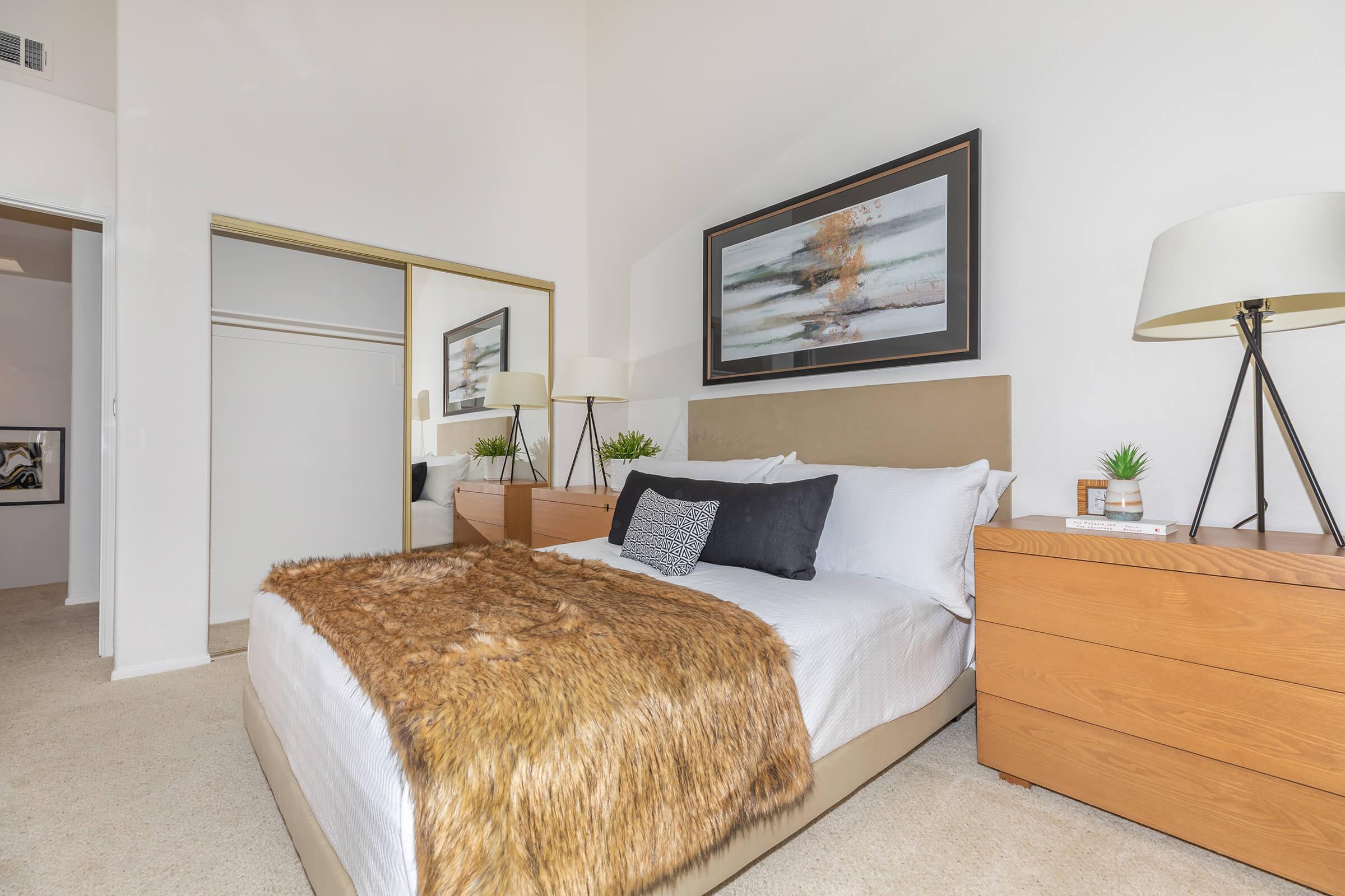 a bedroom with a bed in a room