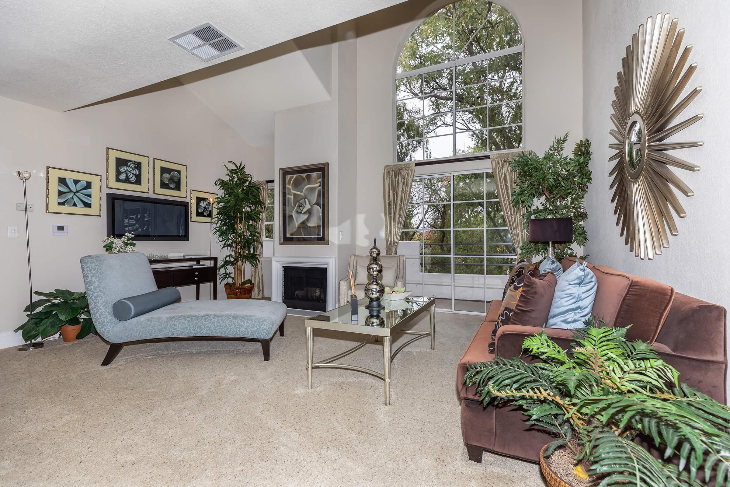 a living room filled with furniture and decor