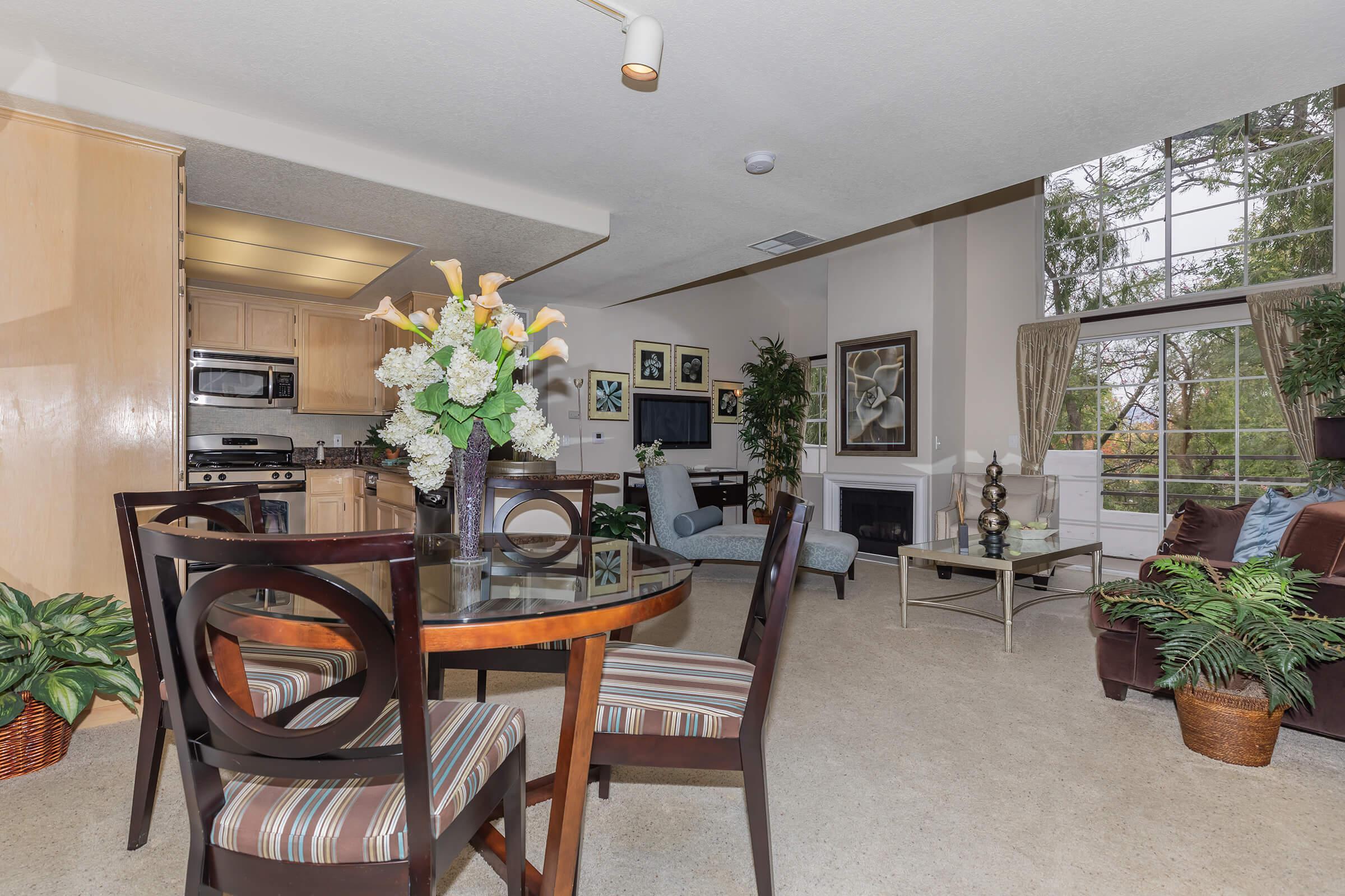 a living room filled with furniture and a fireplace