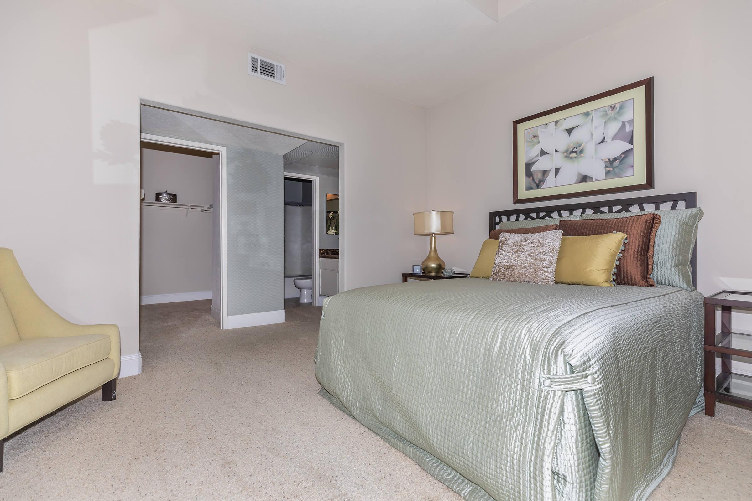 a bedroom with a bed in a room