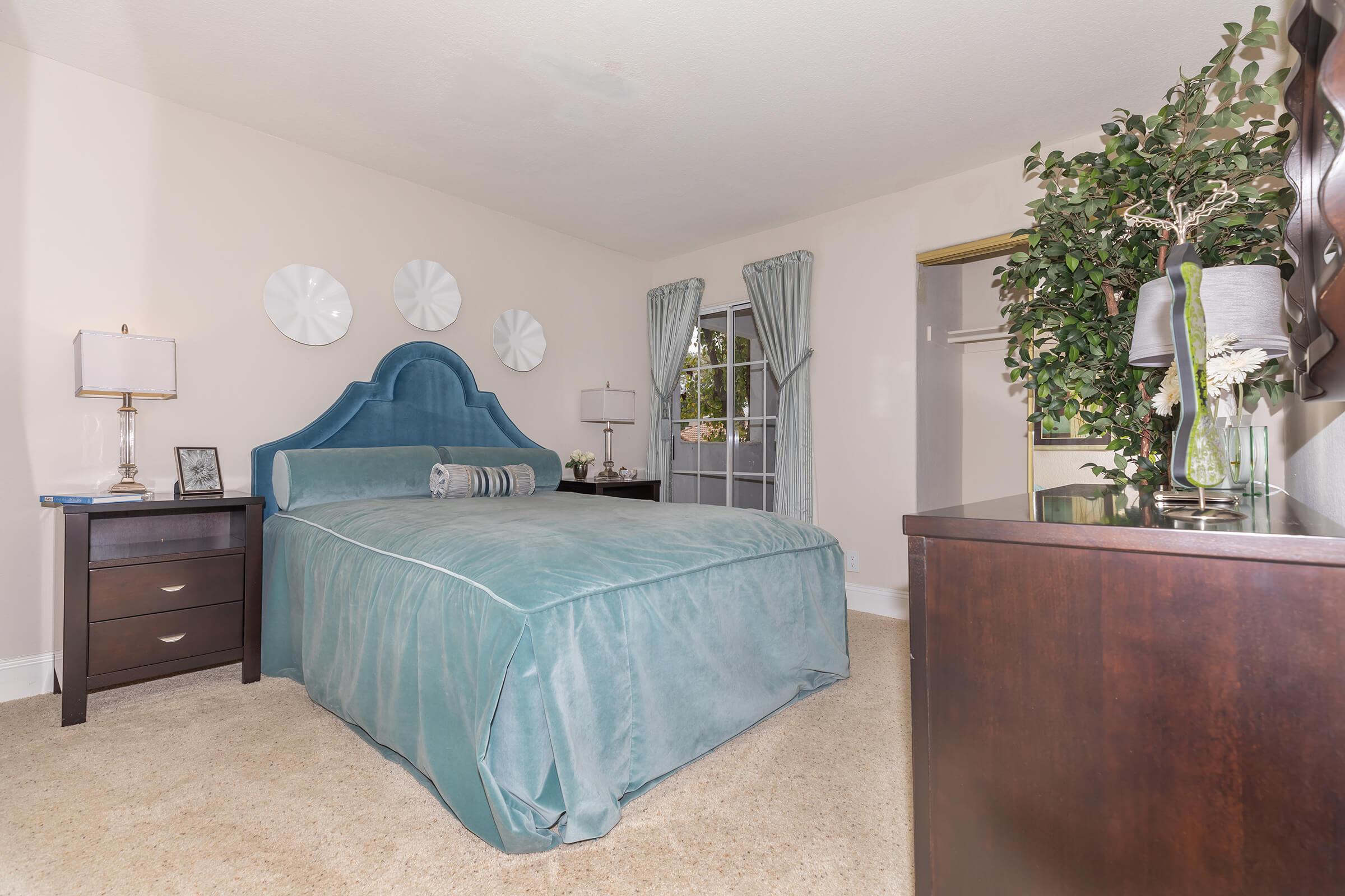 a bedroom with a bed in a room