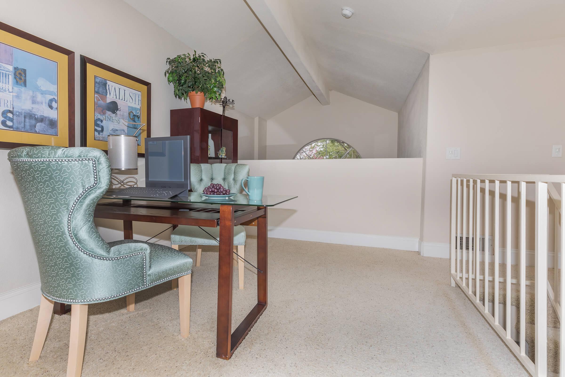 a living room with a couch and a chair