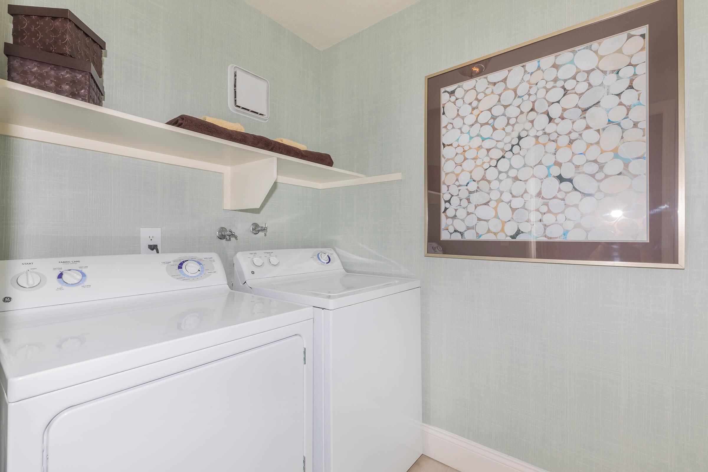 a room with a sink and a mirror