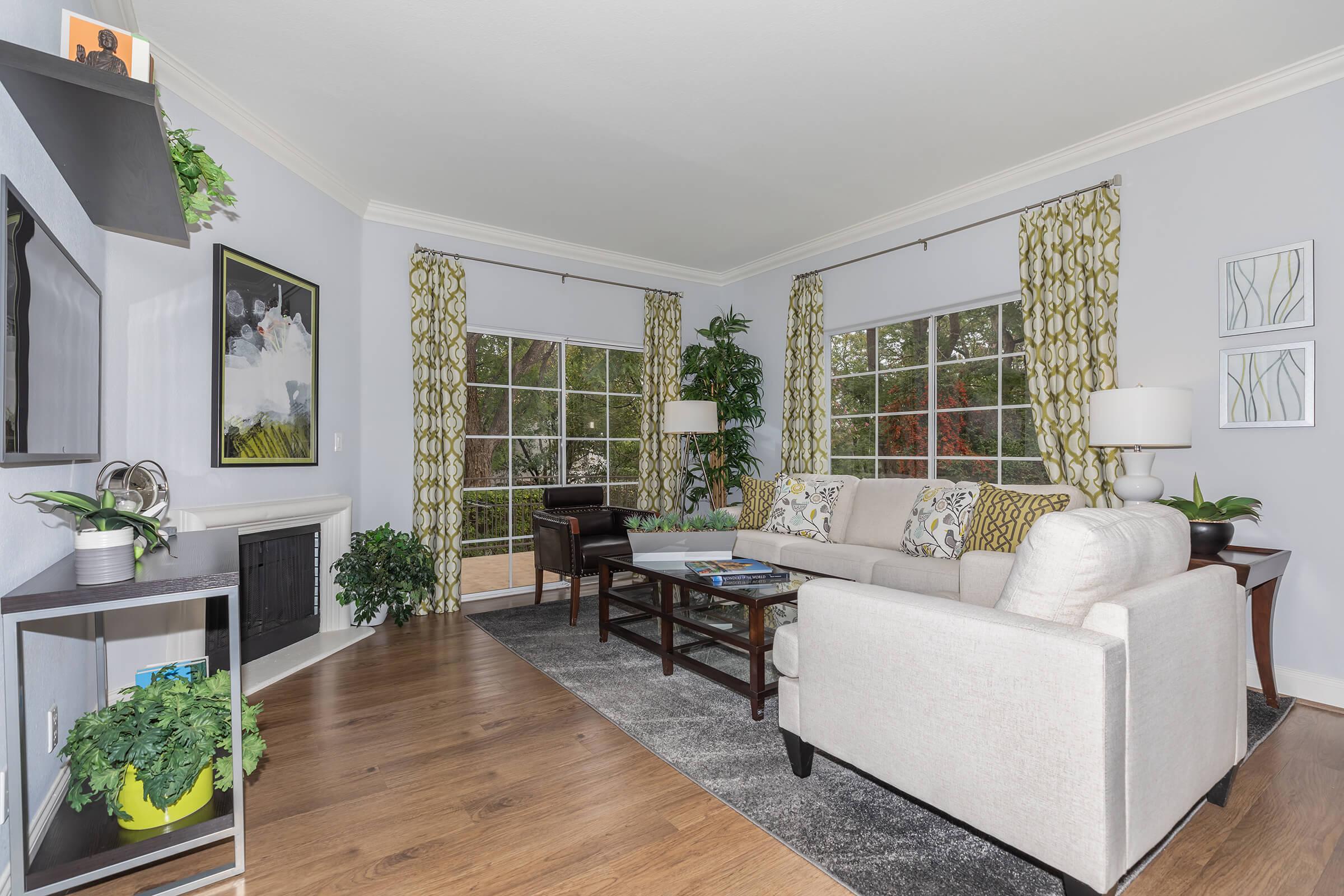 a living room filled with furniture and a fire place