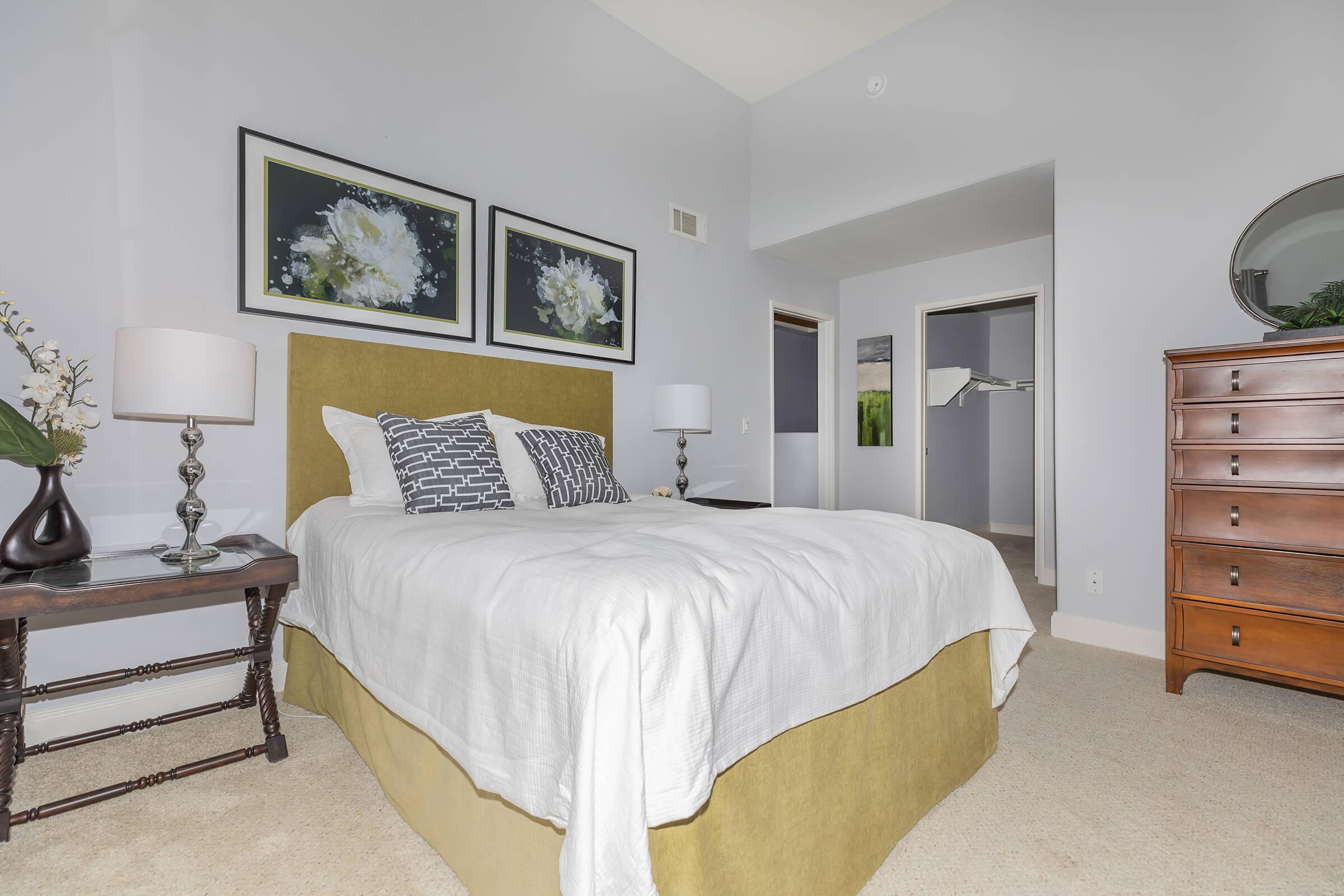 a bedroom with a large bed in a hotel room