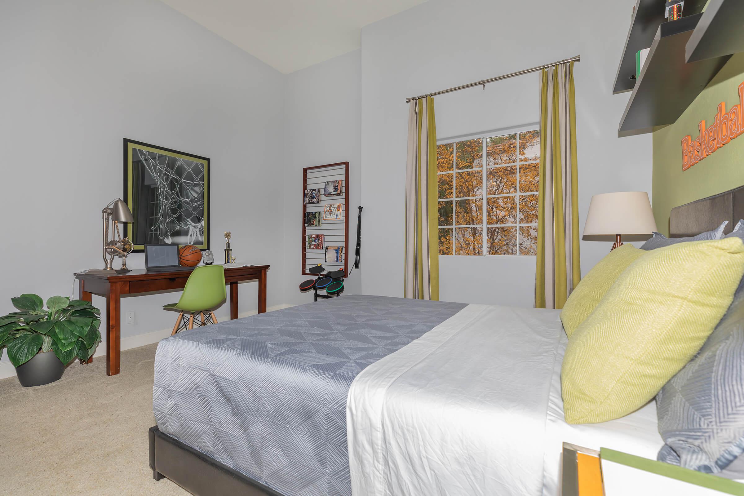 a bedroom with a bed in a room