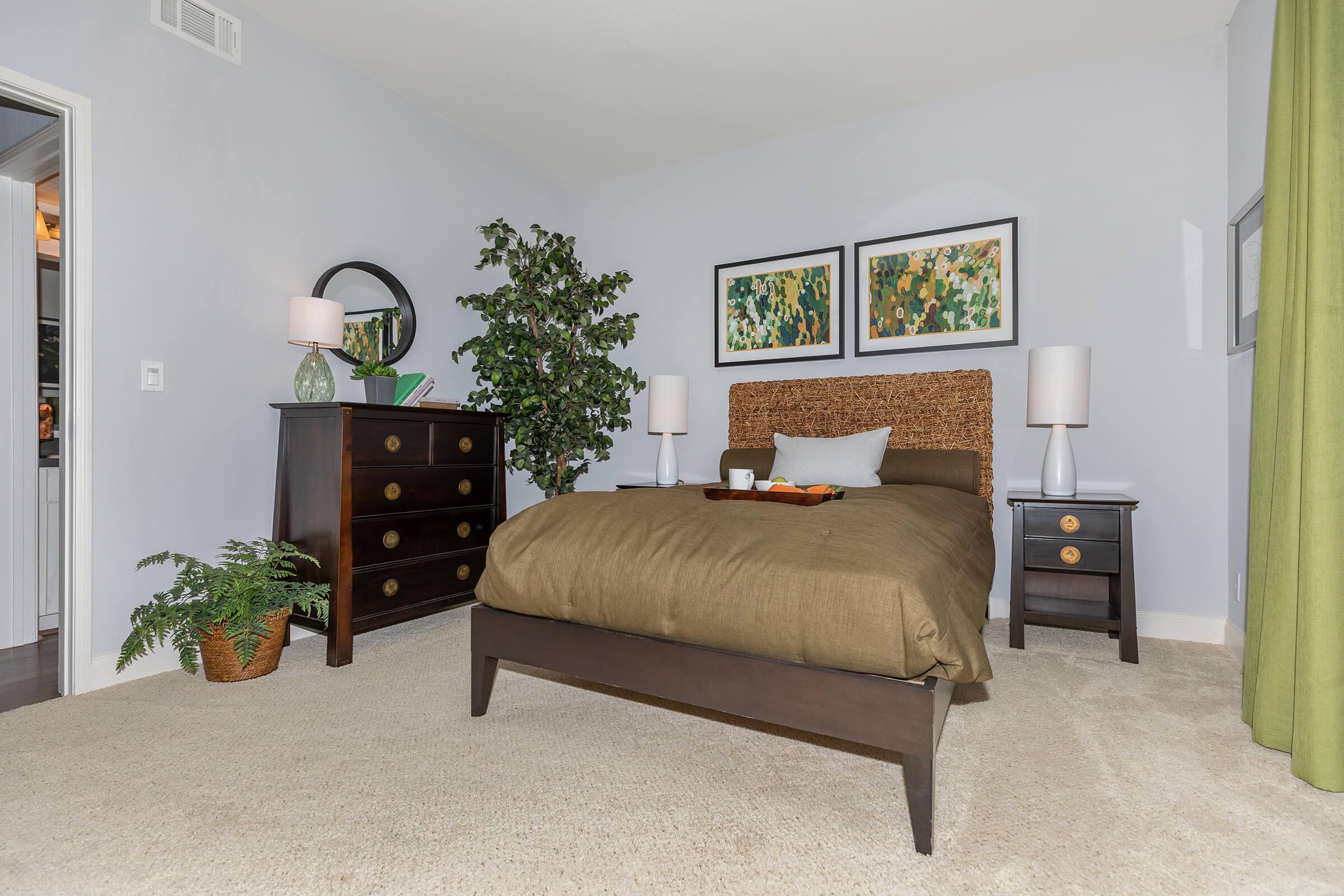 a bedroom with a bed and a couch in a living room