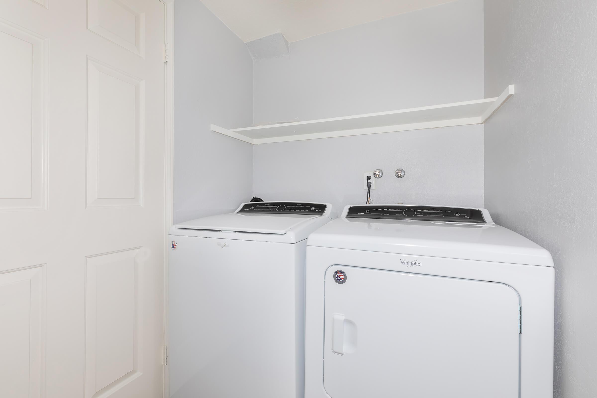 a white refrigerator freezer sitting inside of a kitchen