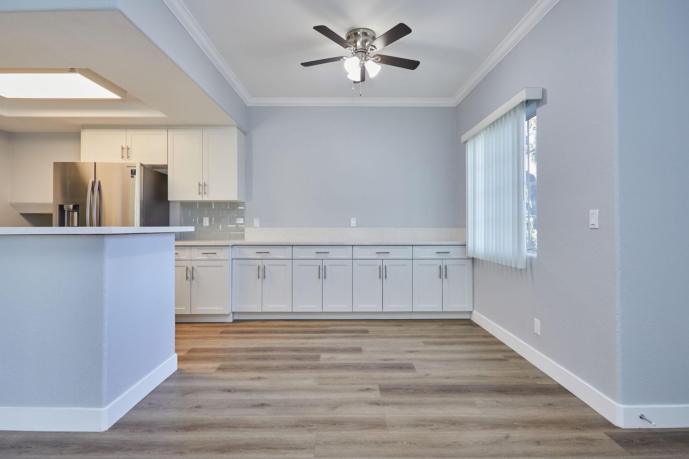 a kitchen area with a building in the background