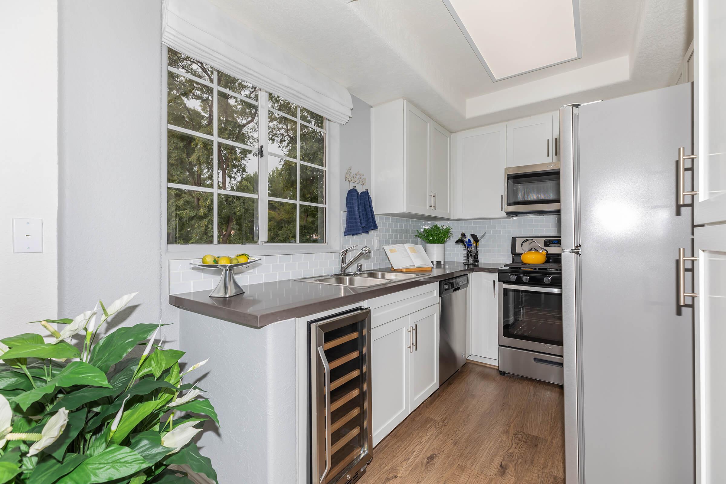 a large white refrigerator in a kitchen