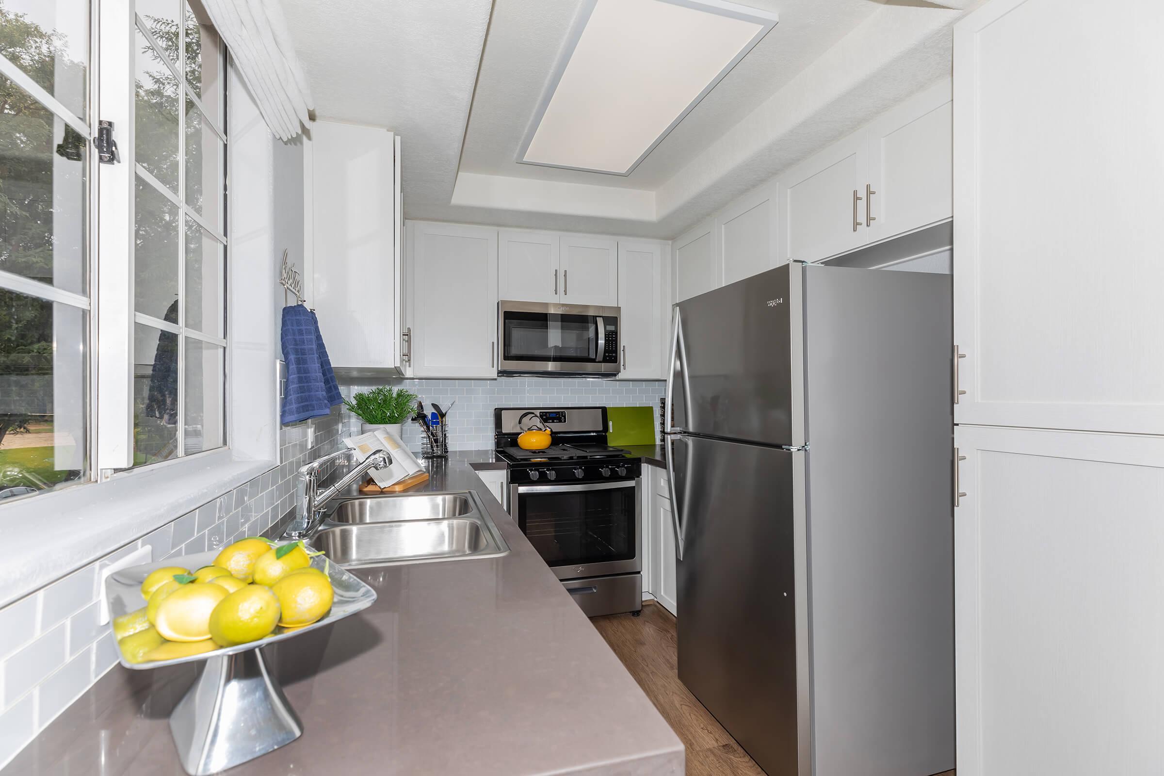 a stainless steel refrigerator in a kitchen
