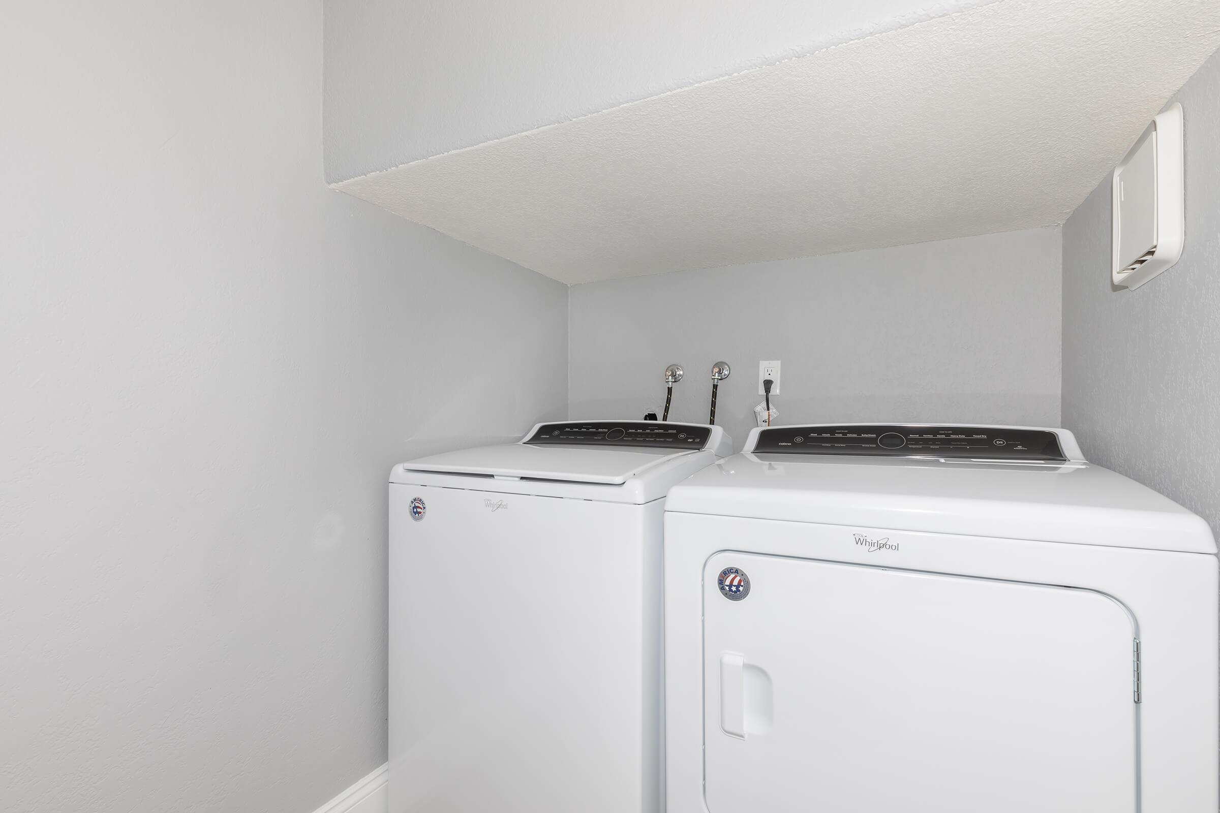a white refrigerator freezer sitting inside of a kitchen