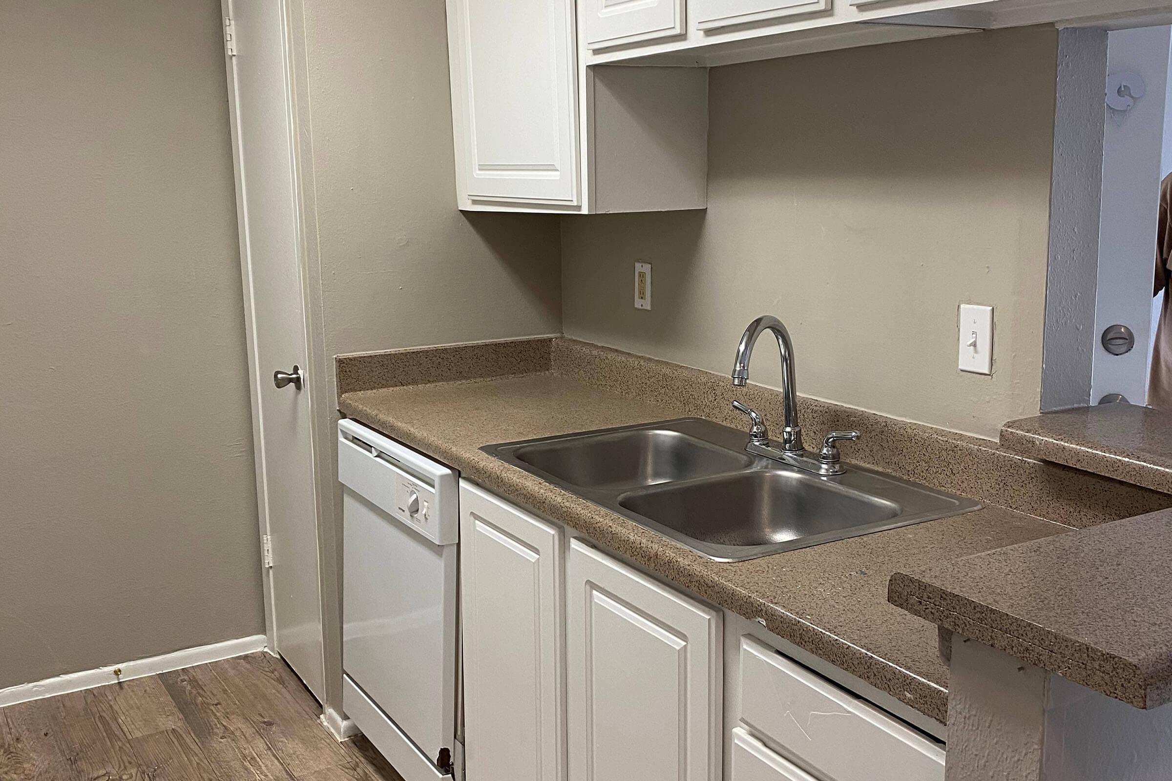 a kitchen with a stove and a sink