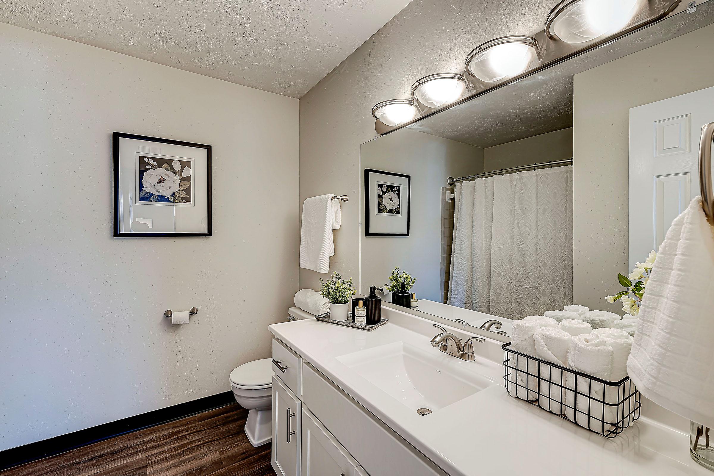 a bedroom with a large mirror